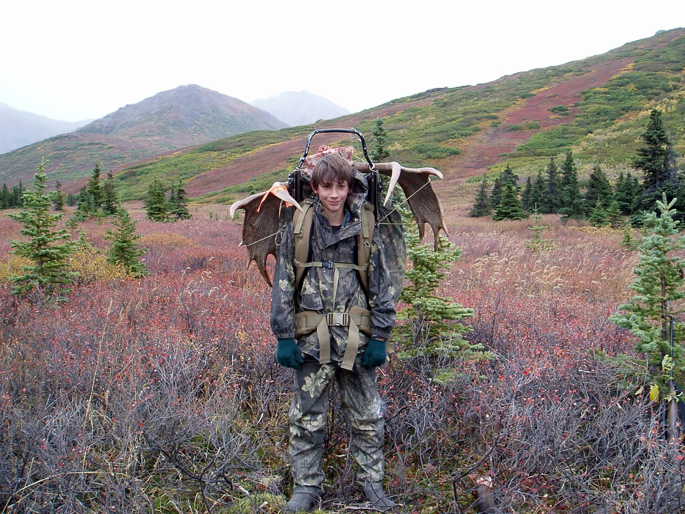 Jared packing his first moose.