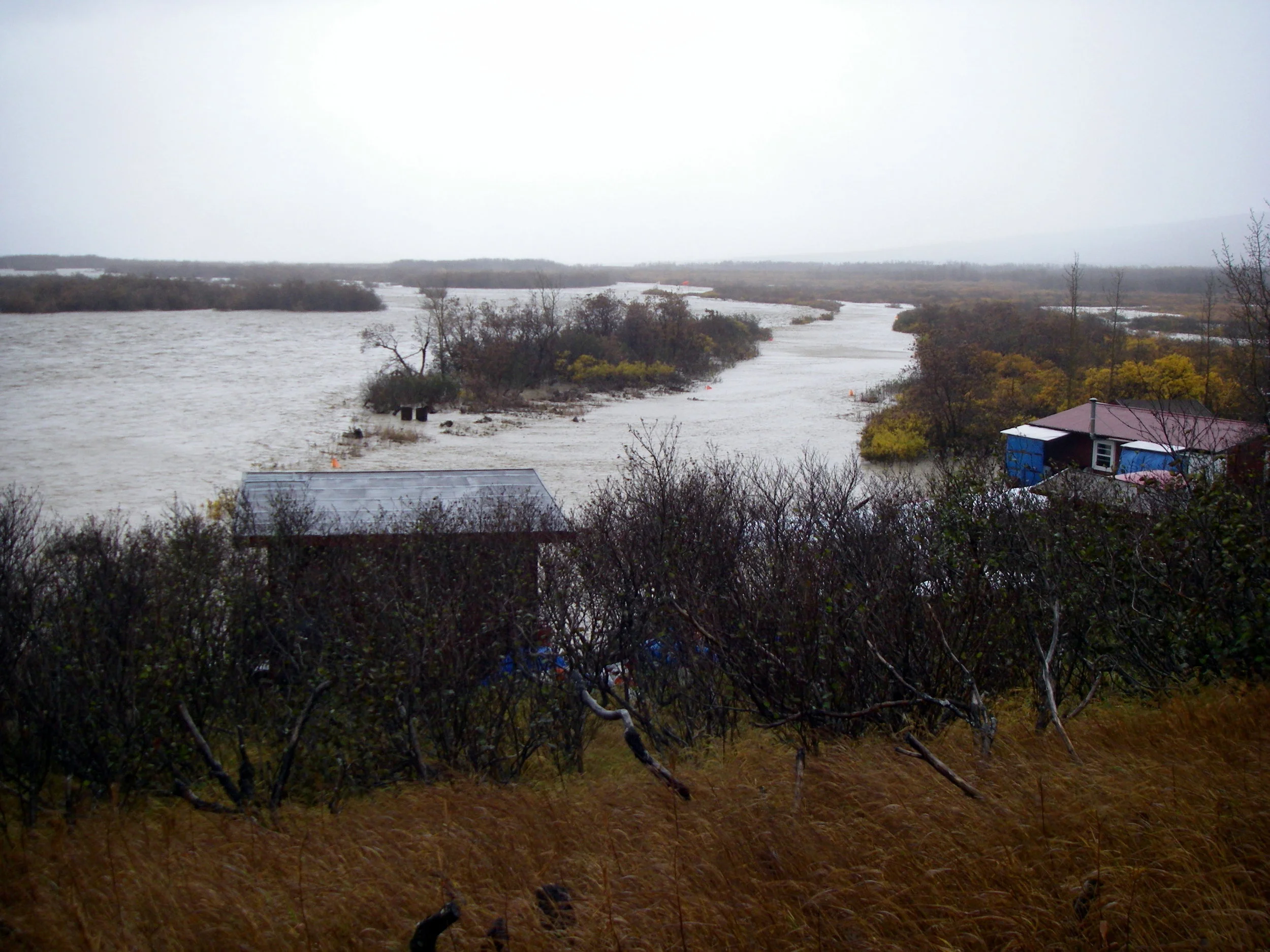 Photo taken from the ridge that blocked the river from hitting the cabins. You are looking down the runway.