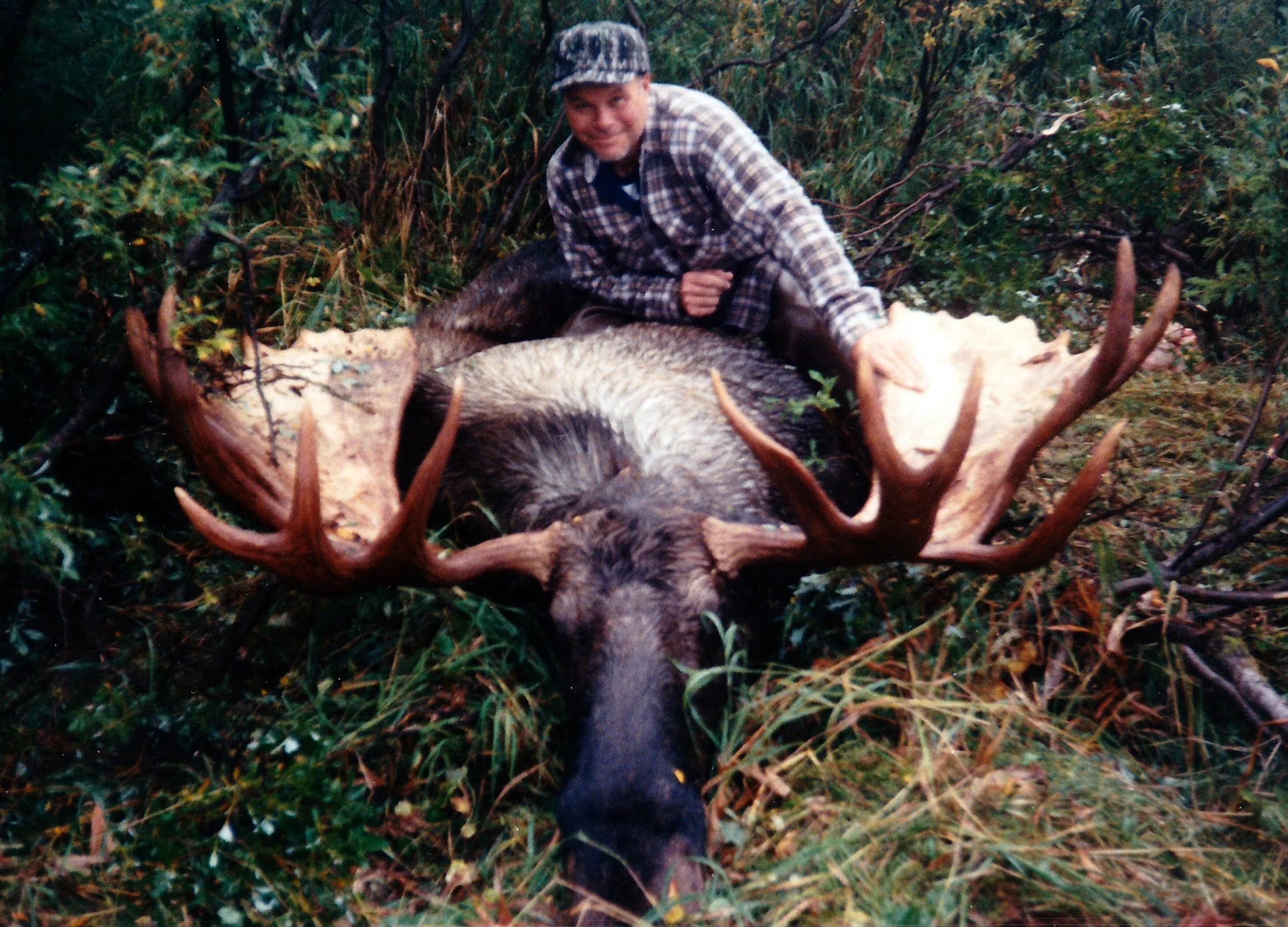 Bob Rhodes, OH, with his 67" spread moose taken in Western Alaska in '89.
