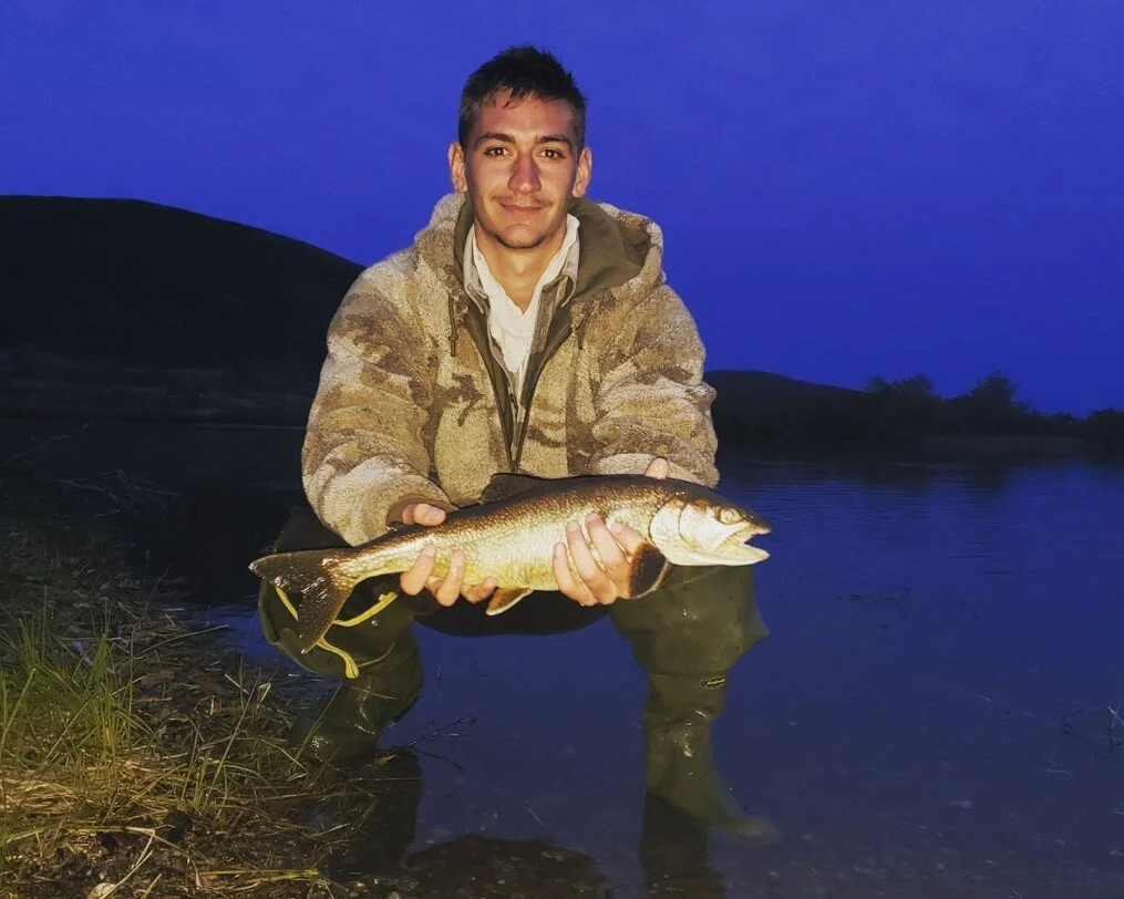 Nathan with a nice Lake Trout. Late evening fishing.