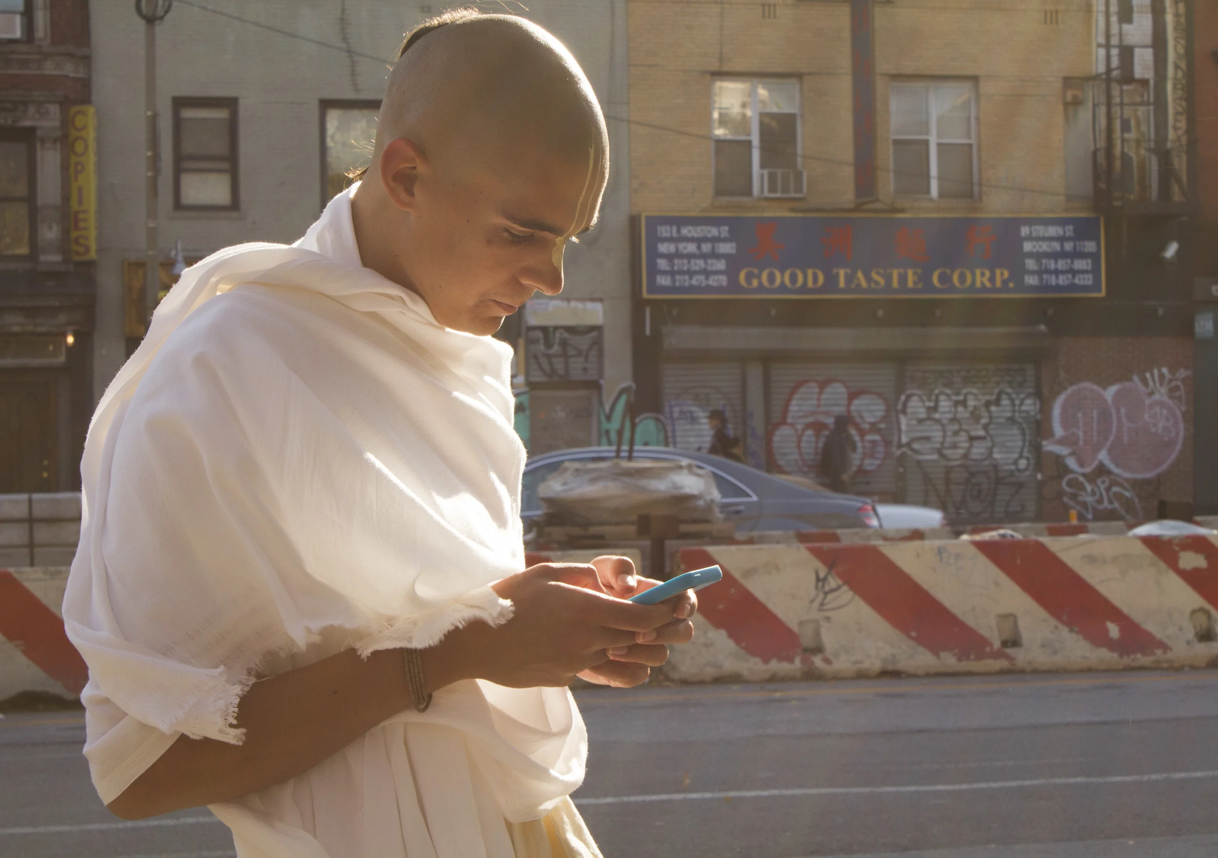Hare Krishna monk Alex Seibel, 19, checks directions en route to pick up his visa for a trip to India.
