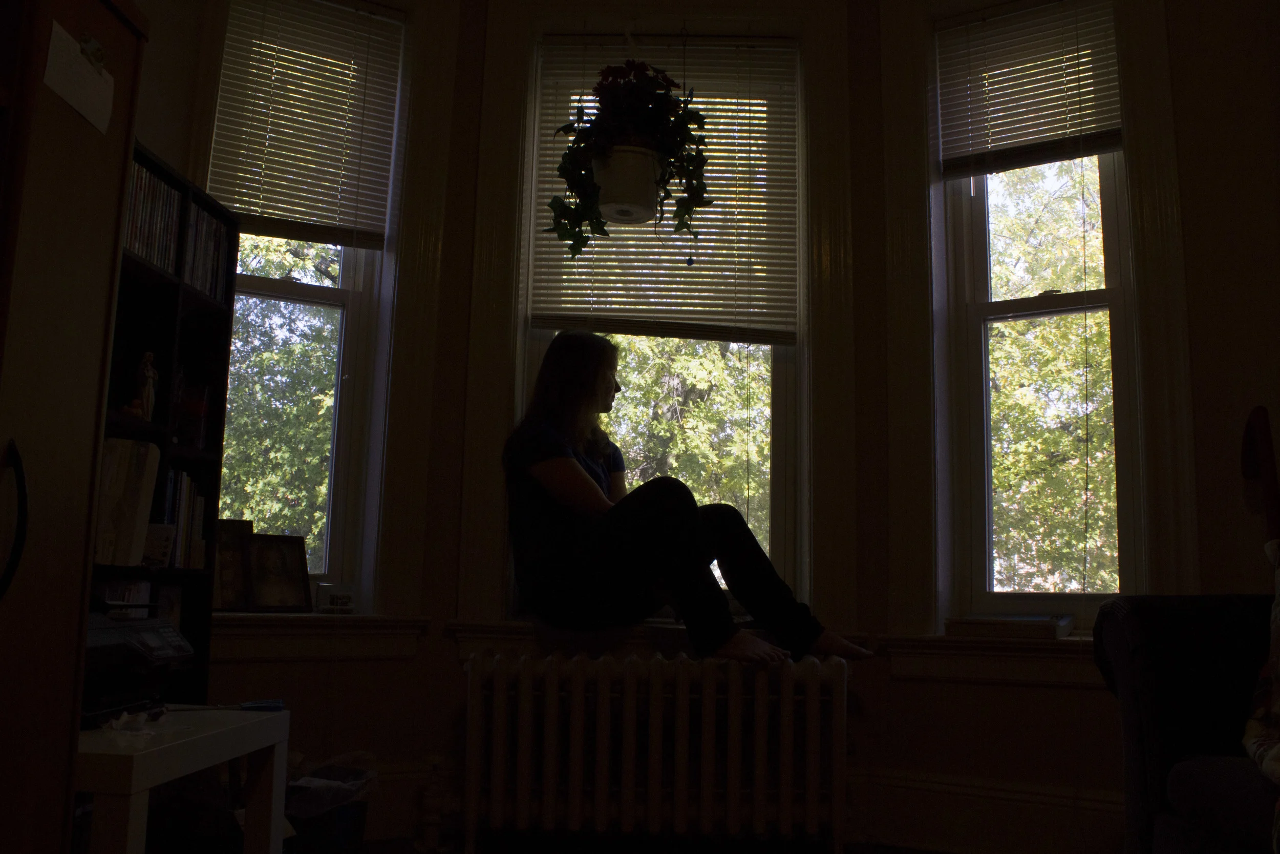 Catholic Minister Melissa McChesney, 24, in the living room of her Brooklyn apartment. McChesney, a Kentucky native, studied to become a police officer before finding religion. 