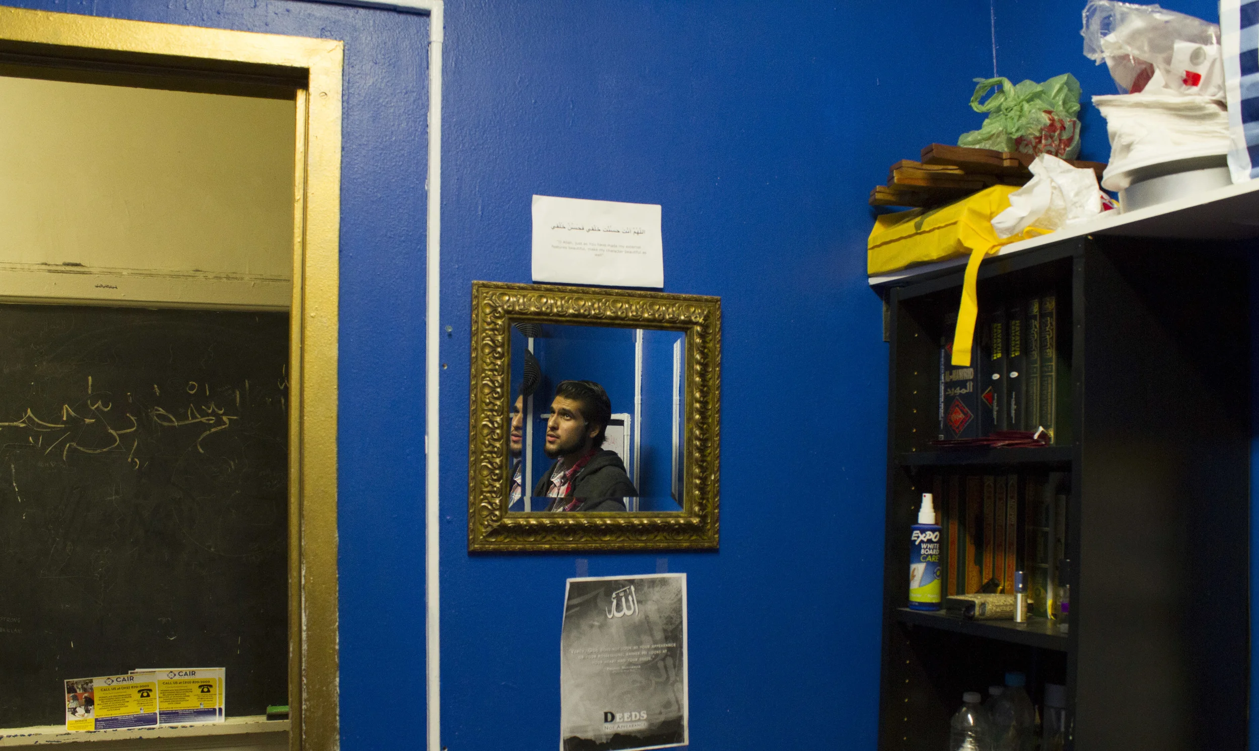Navel Shah, 19, gets ready for late afternoon prayers in the Muslim prayer room at the school. 