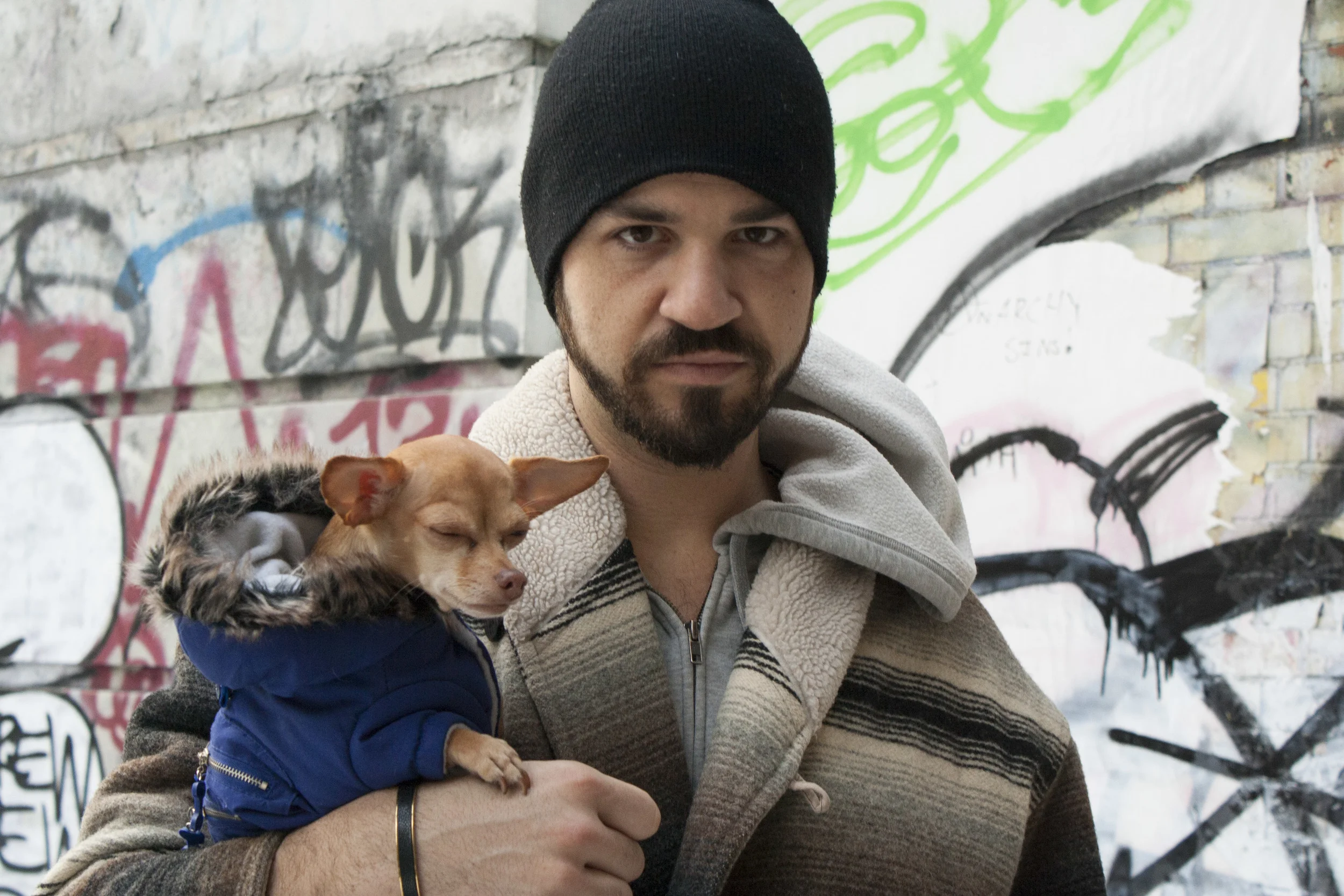 A man and his dog on Avenue B. 