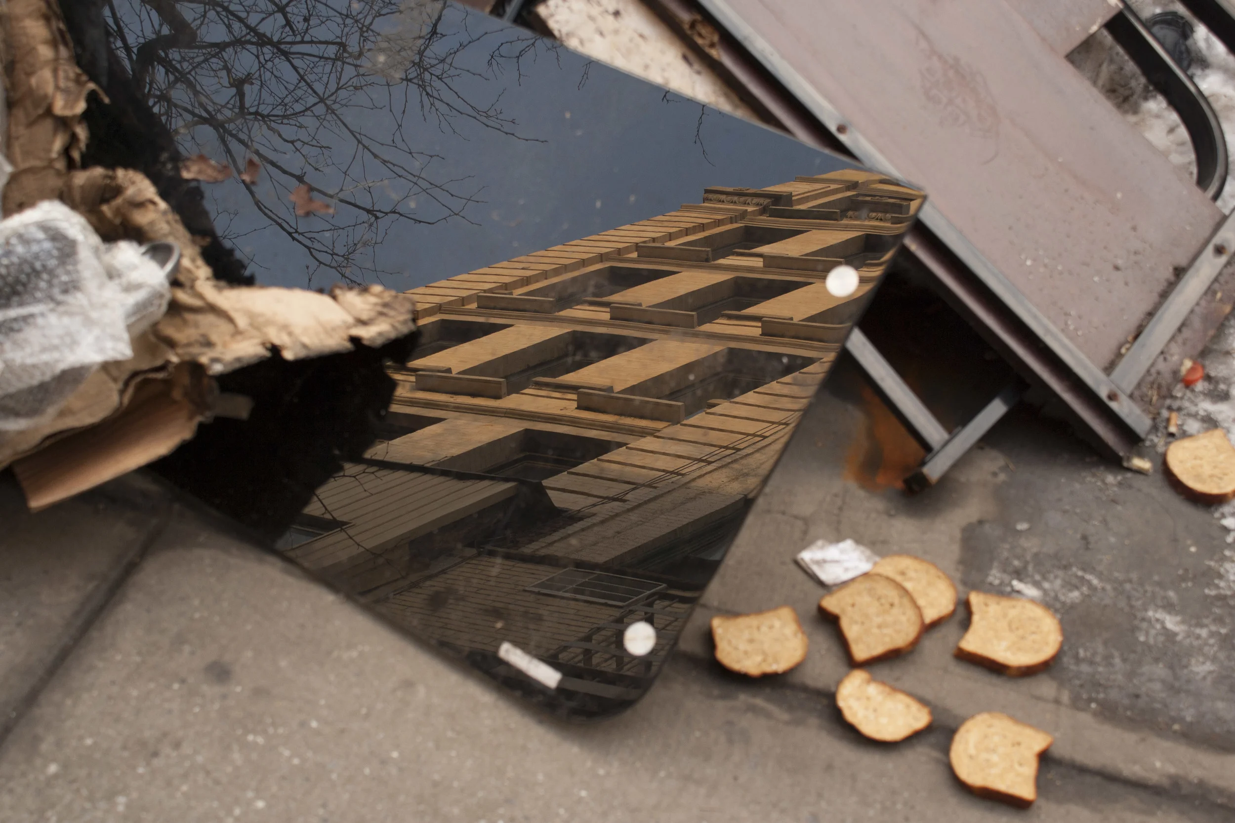 Reflections and bread on Avenue A. 