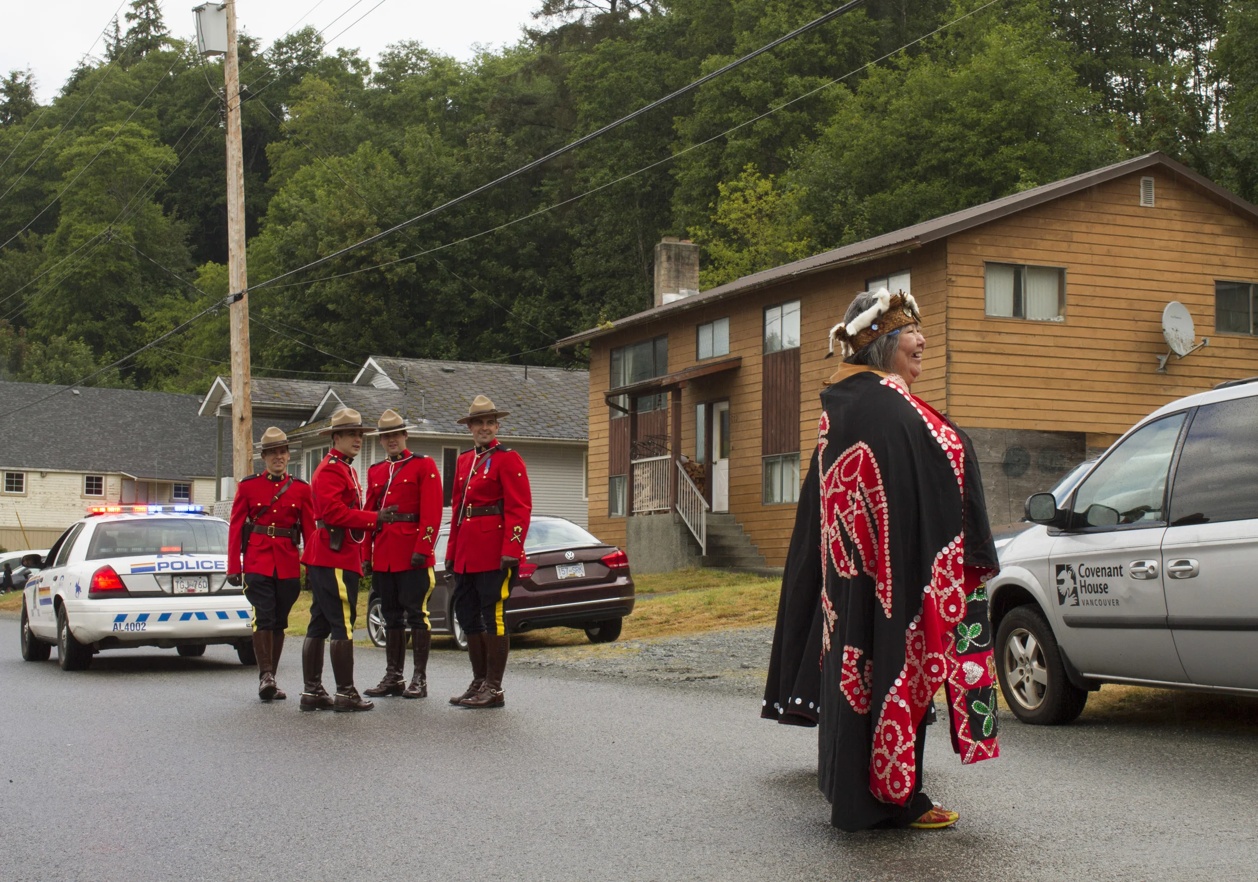 'Namgis First Nation Chief Debra Hanuse and RCMP wait to begin the June Sports parade in Alert Bay, B.C. © North Island Gazette