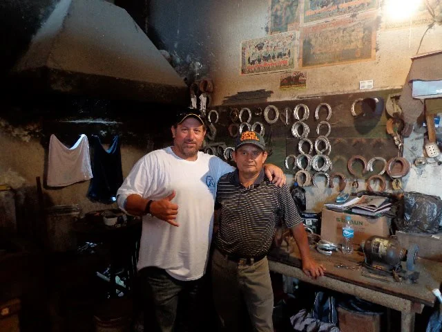 With my friend the late and best farrier in Peru "Pajarito " RIP mi amigo . We were making shoes at his shop in the Racetrack in Lima.