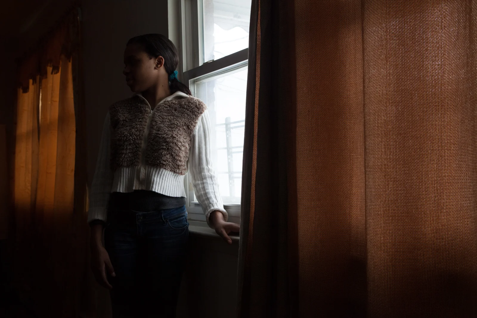 G. (name changed to protect identity) poses for a portrait in her home in East New York, Brooklyn. G. suffered a rape at the hands of a classmate at her middle school and then was asked to transfer to a different school. Photographed on assignment for Buzzfeed News.