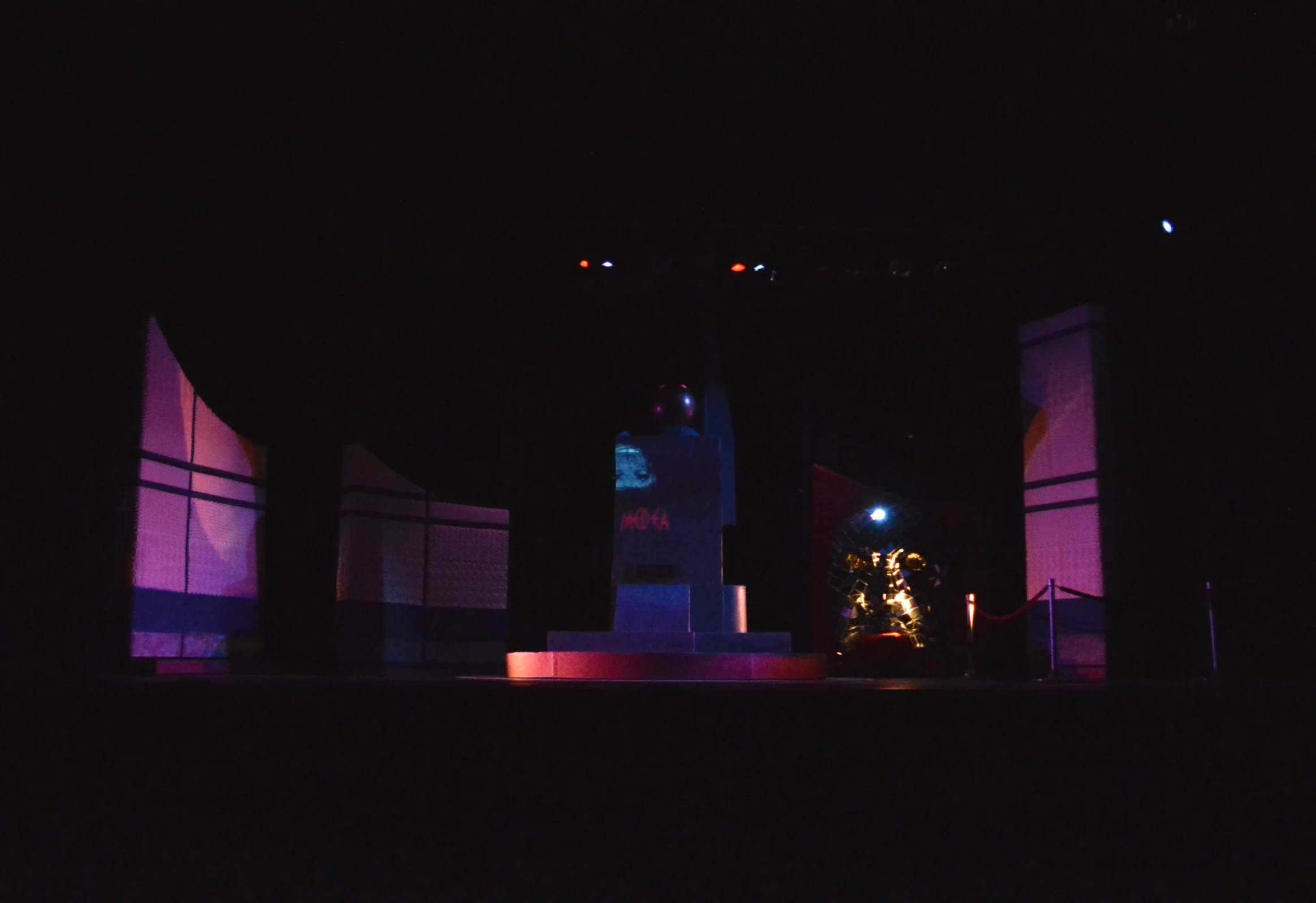 Scene transition into a theatre exterior.
