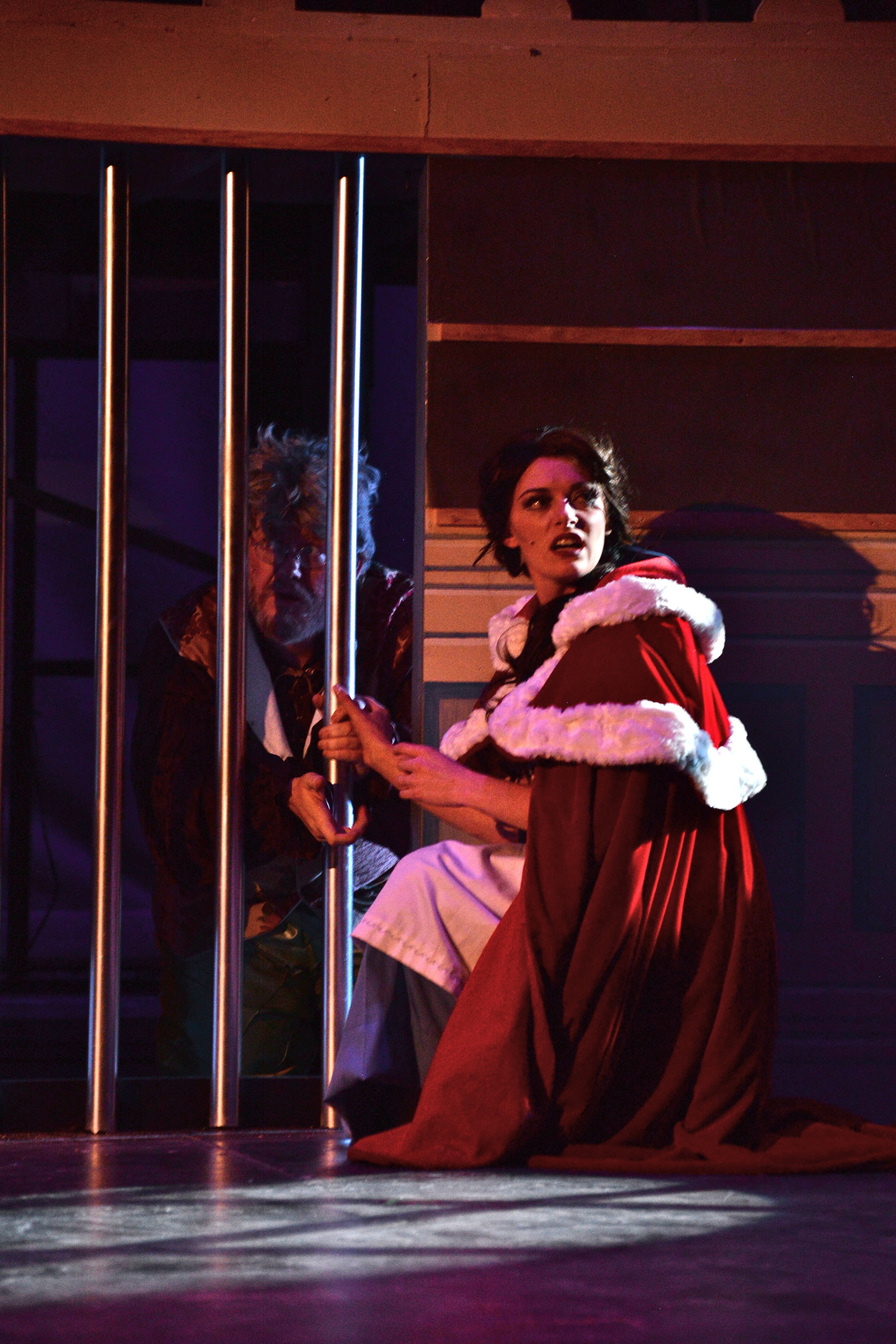 Belle finds Maurice, her father, imprisoned.