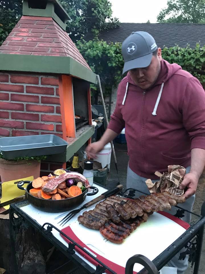 Cristian Palomo being the master parillero at our previous asado.