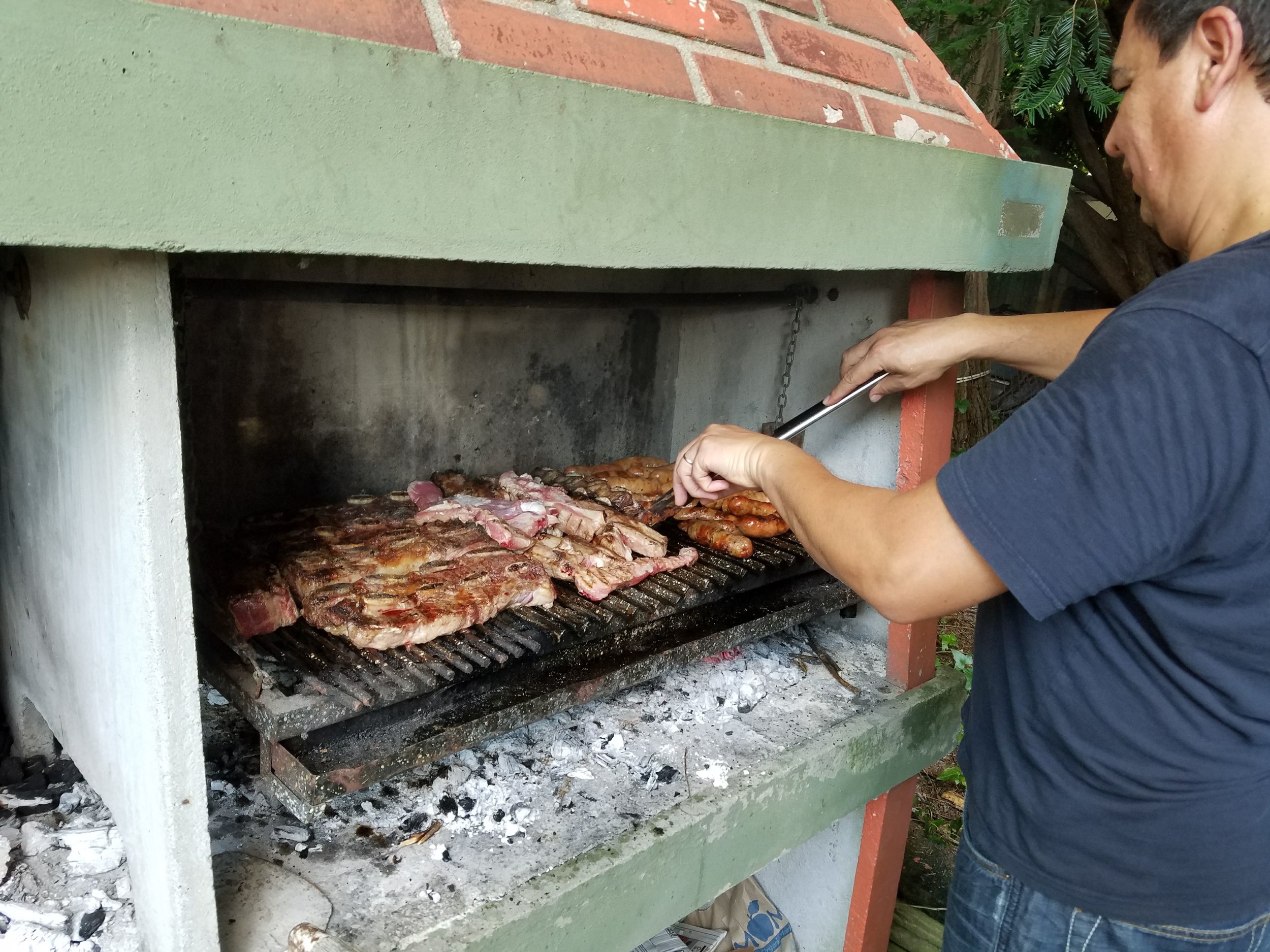 Armando manning the parilla (grill) for us after workshop!