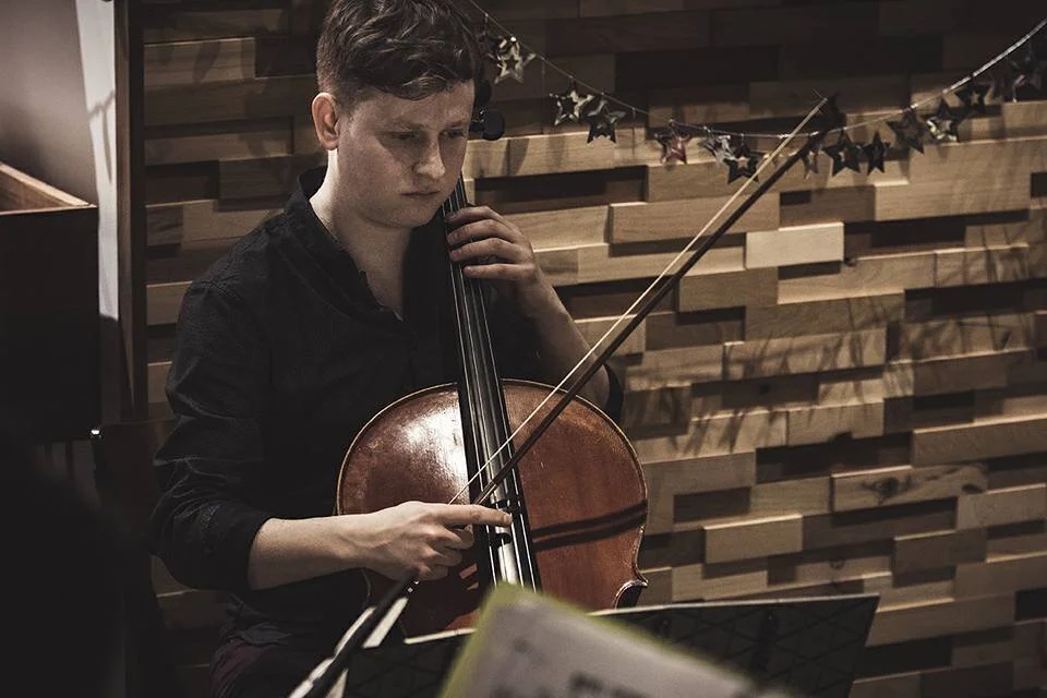 Max plays cello.jpg