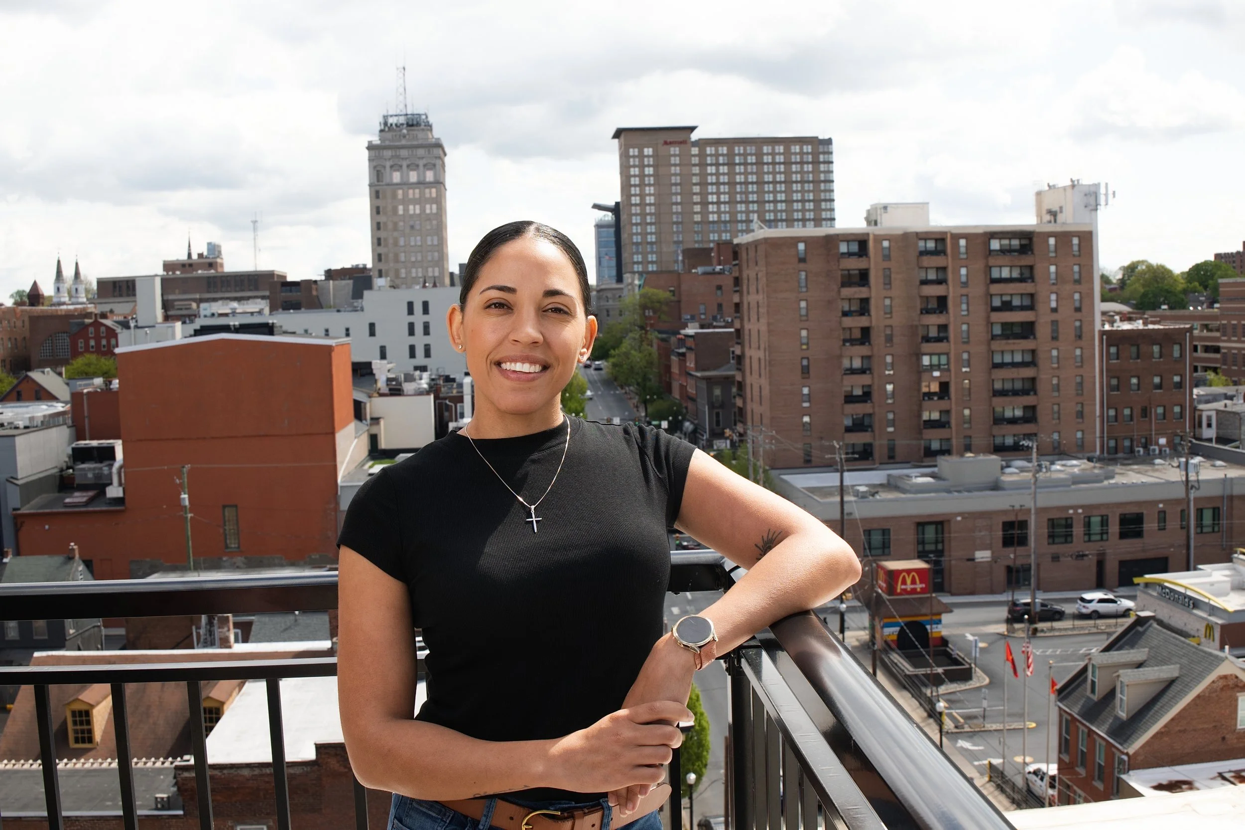female standing outside with Lancaster City in the background