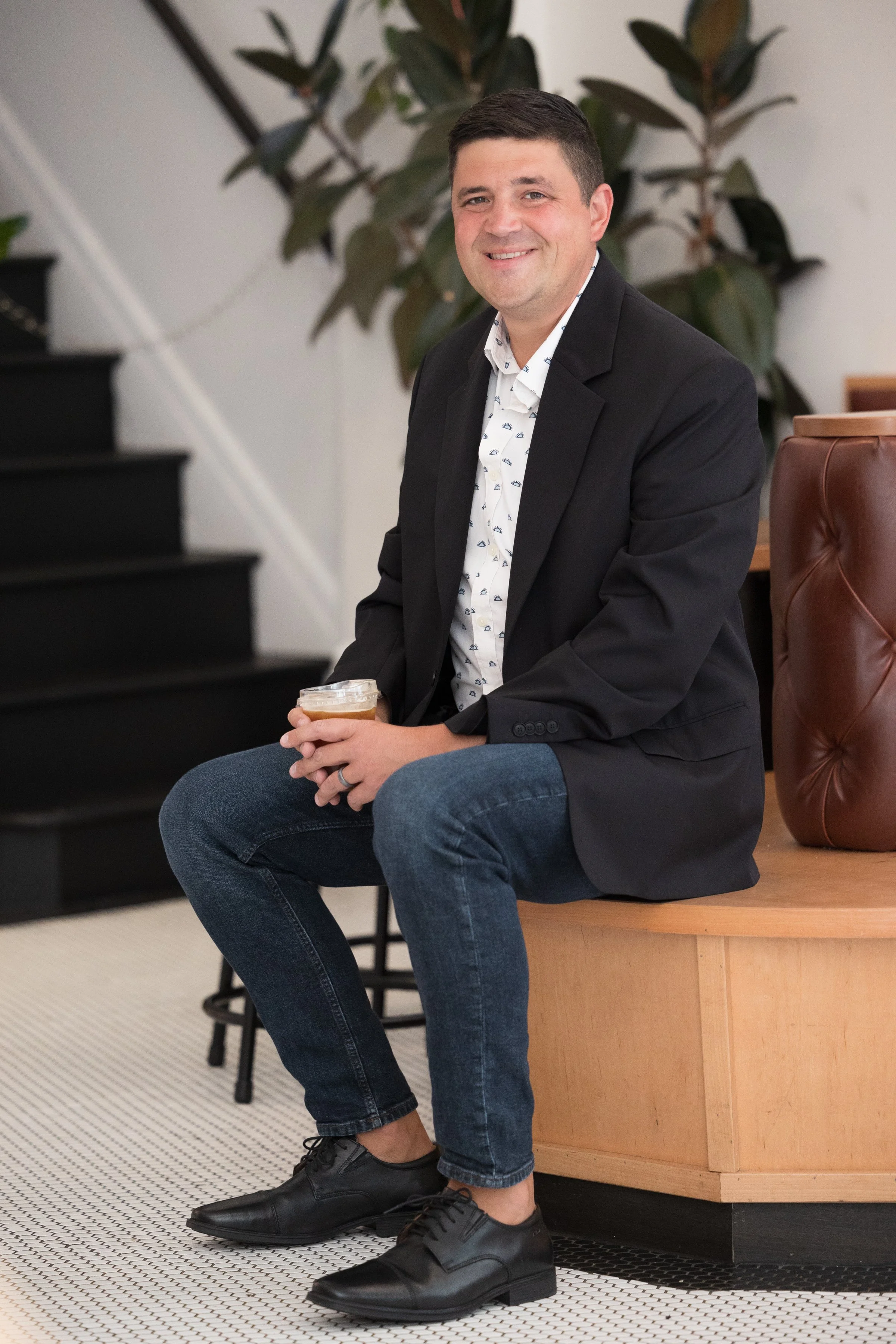 man sitting in Passenger Coffee holding a coffee