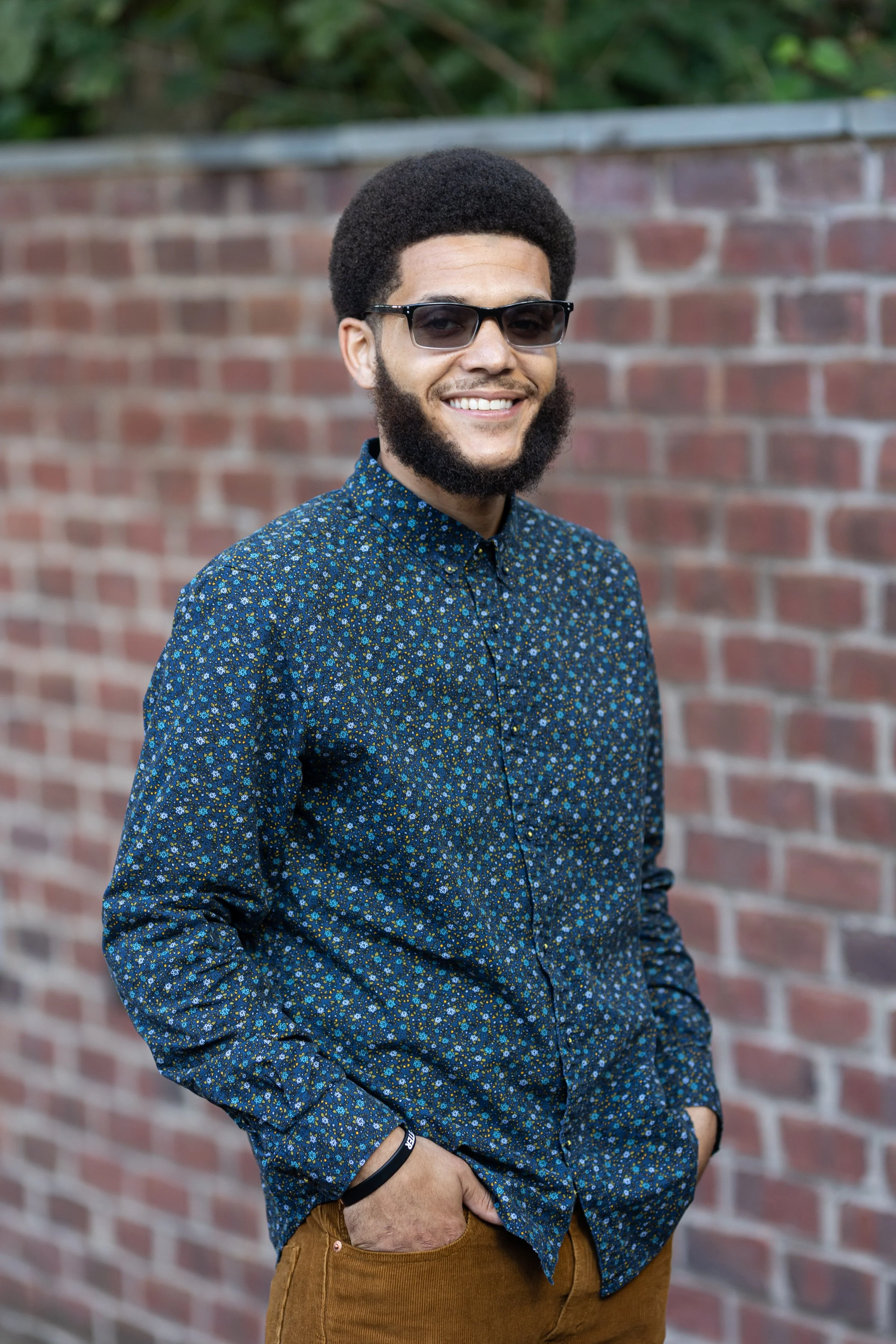 male portrait outdoor brick background