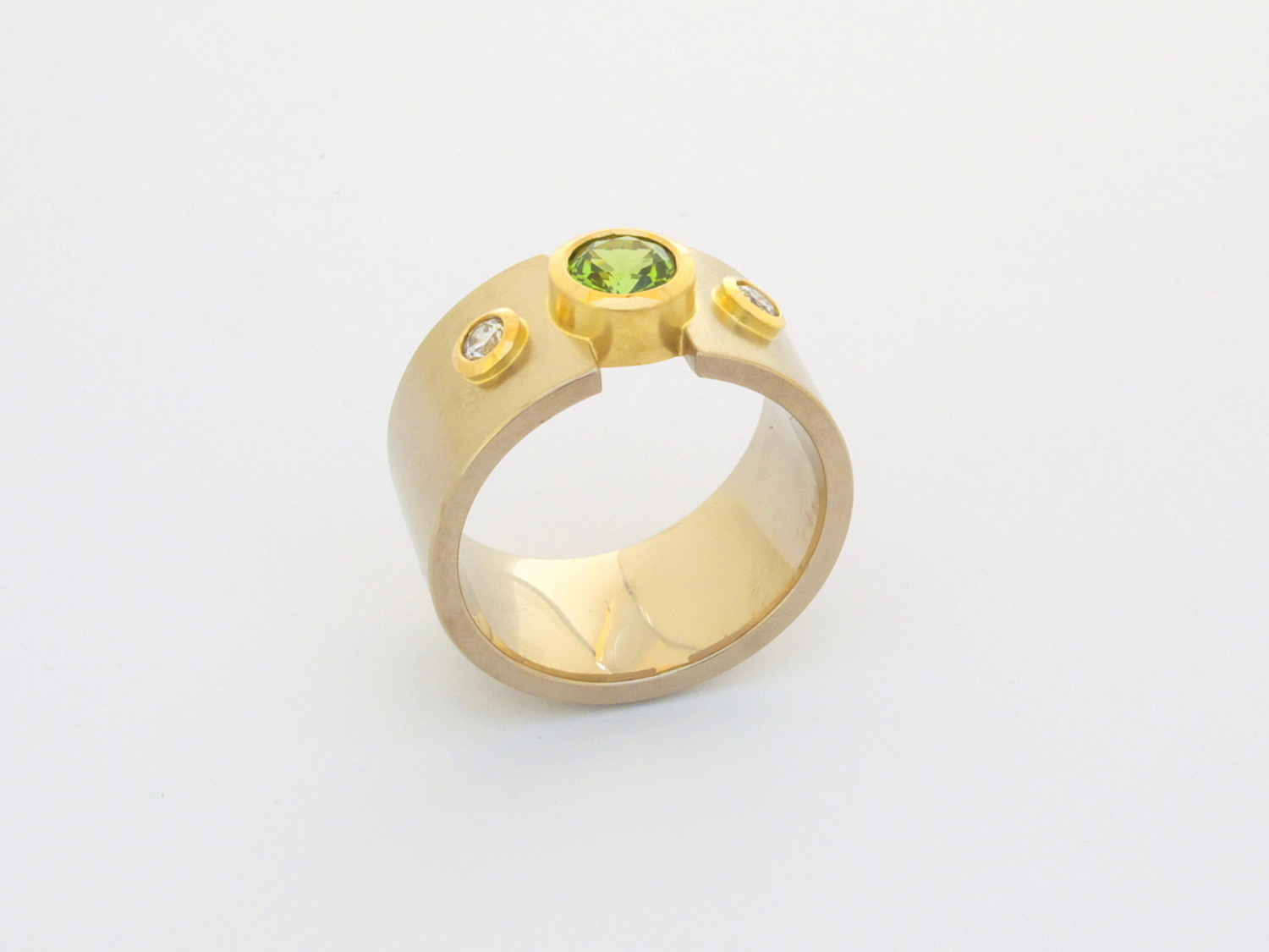  18ct white &amp; yellow gold engagement ring set with clients own diamonds and a tsavorite garnet 