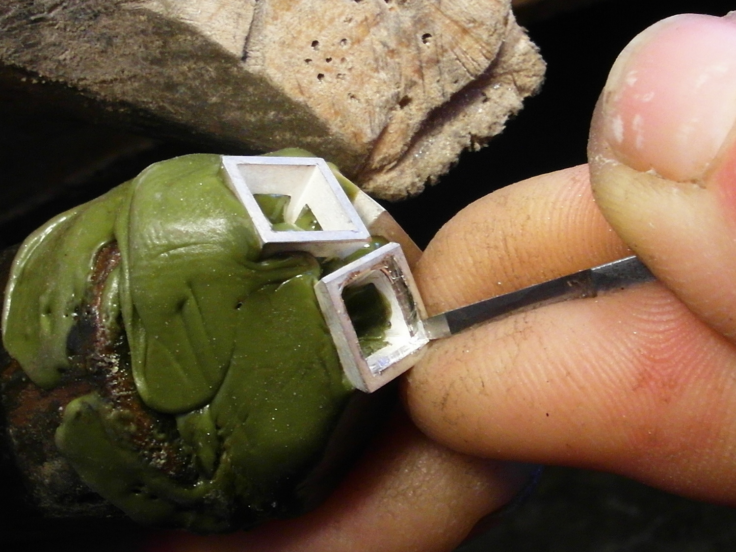  Come in with you graver straight down to clean out and sharpen the corners. 
