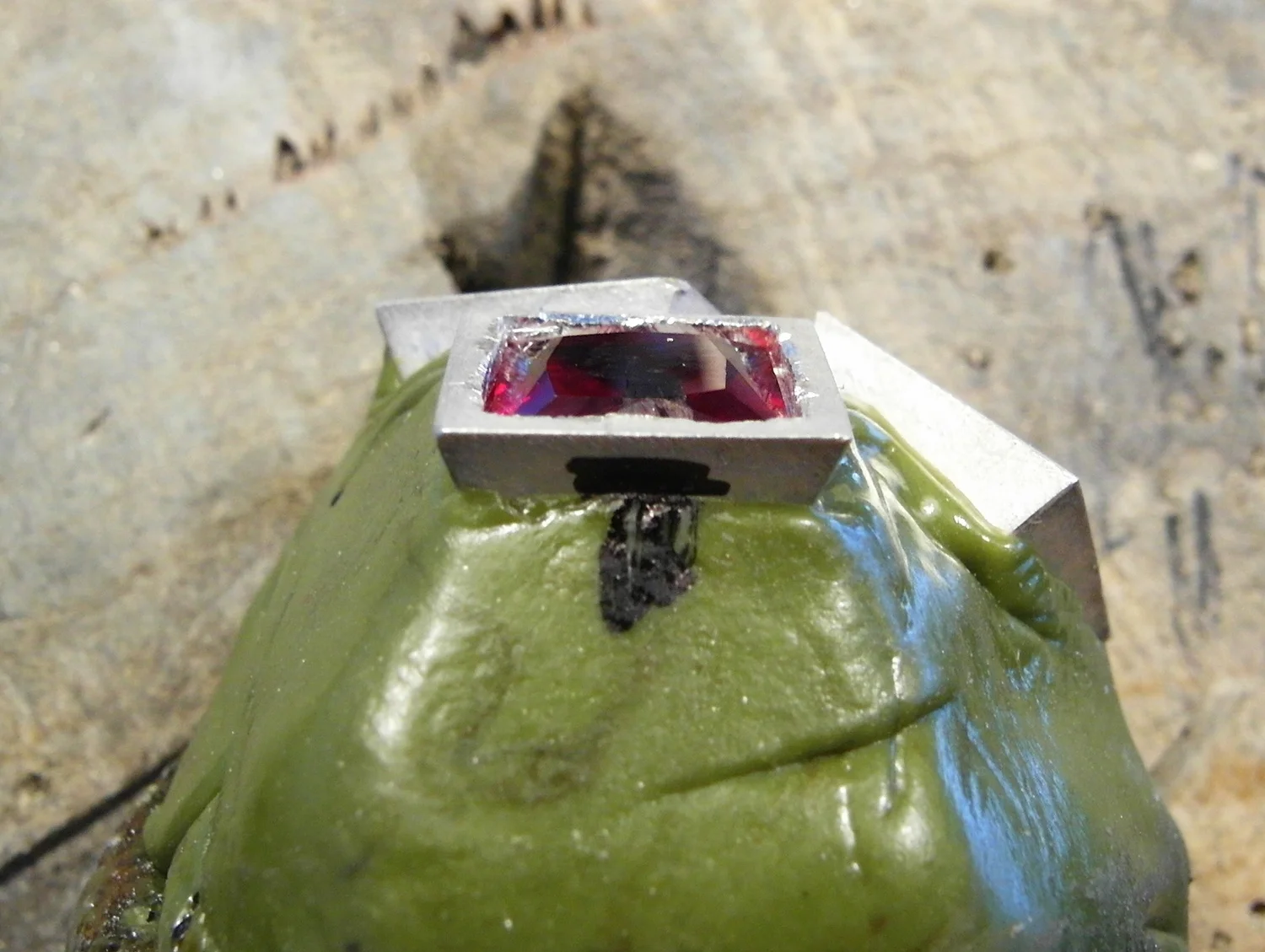  Check that the stone is fitting well and not rocking when you push and prod with the point of the toothpick. 