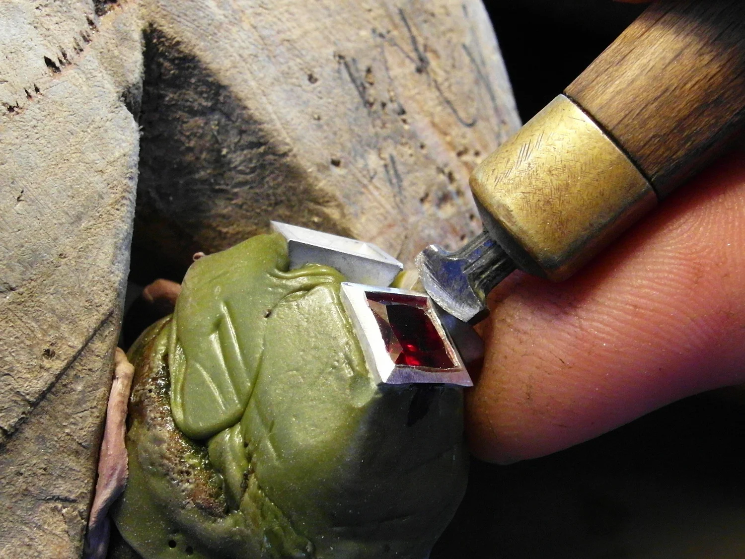 Here, we start with the hand-setter.&nbsp;Again, start at the corner, note that the angle of attack is steeper. Push firmly and rock it side to side, looking always between the metal and the stone. Work around all corners 1,3,2,4 and then the sides.