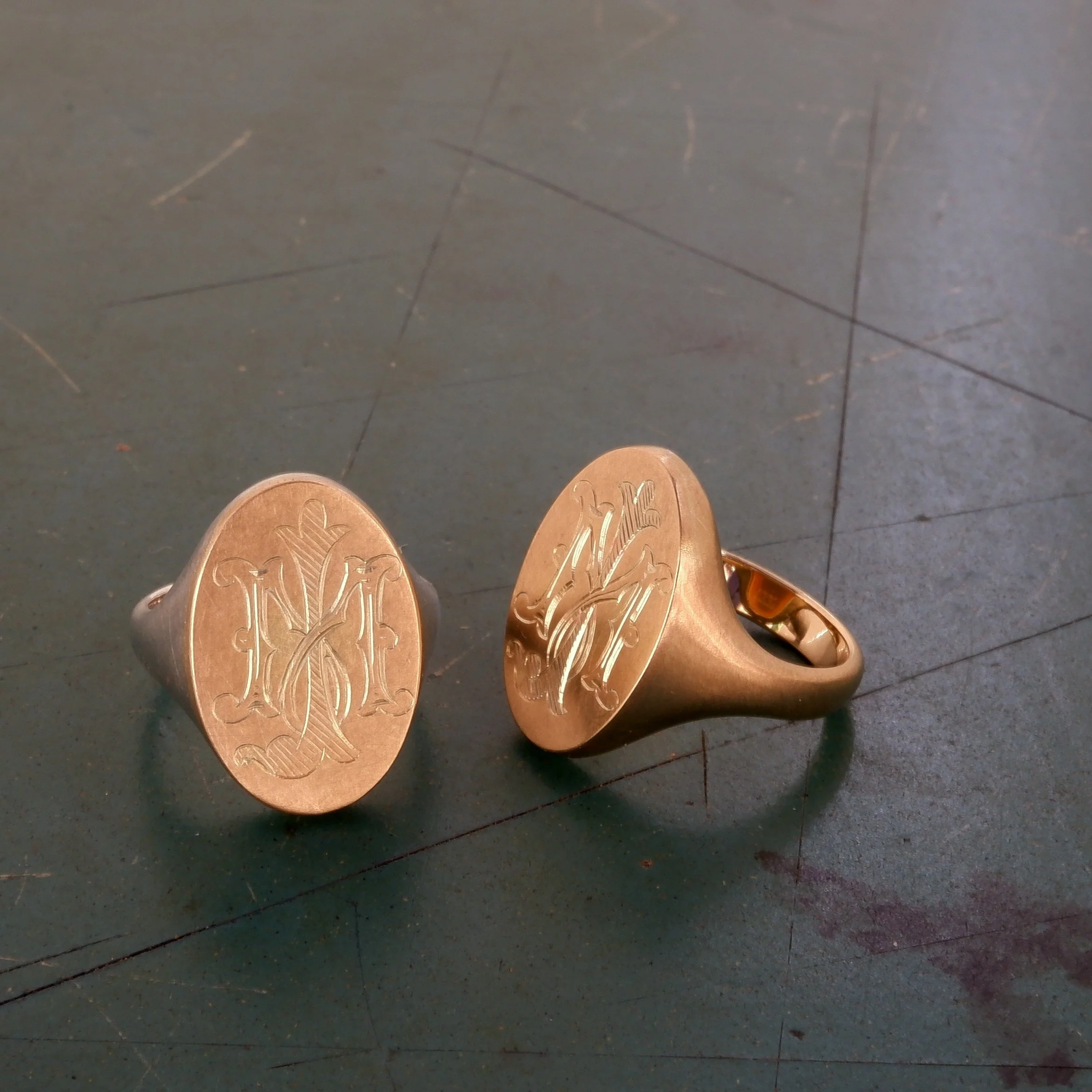 A pair of 9ct yellow gold signet ringsmade for mother and daughter from grandfather's cufflinks.