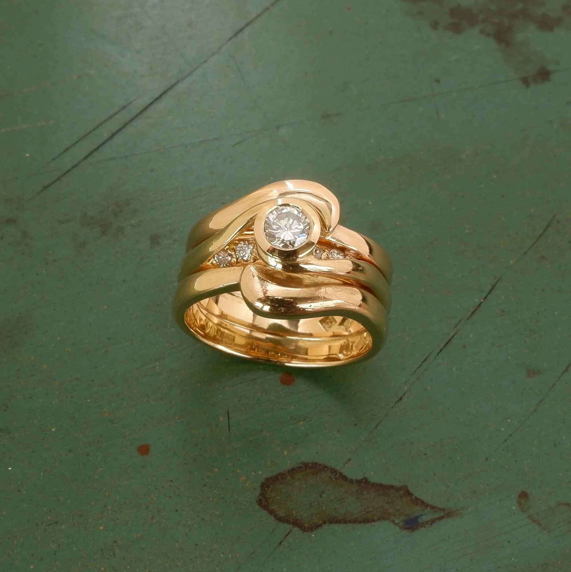 A new 3rd gold ring was made to finally complete the 3 ring set.