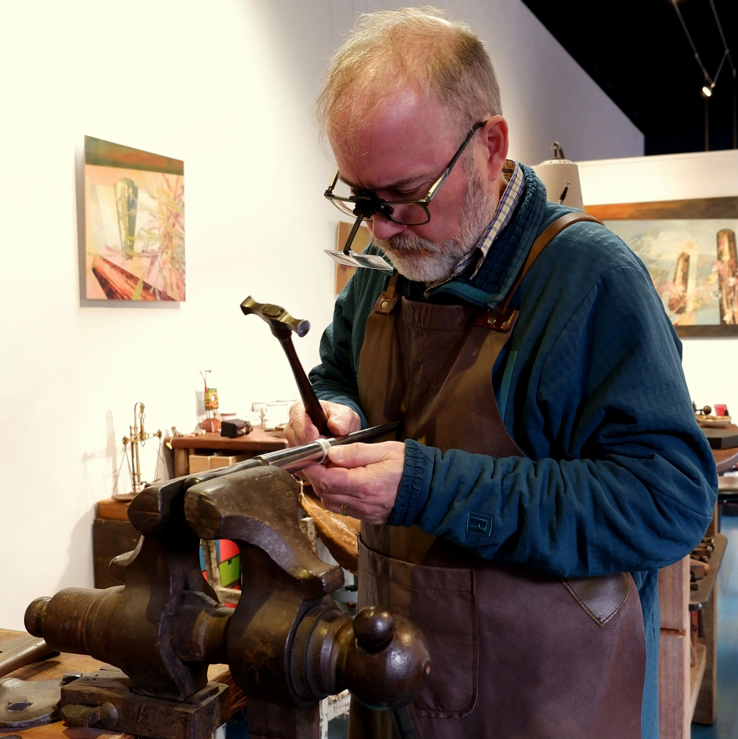 Owen planishing a silver ring - Copy.JPG