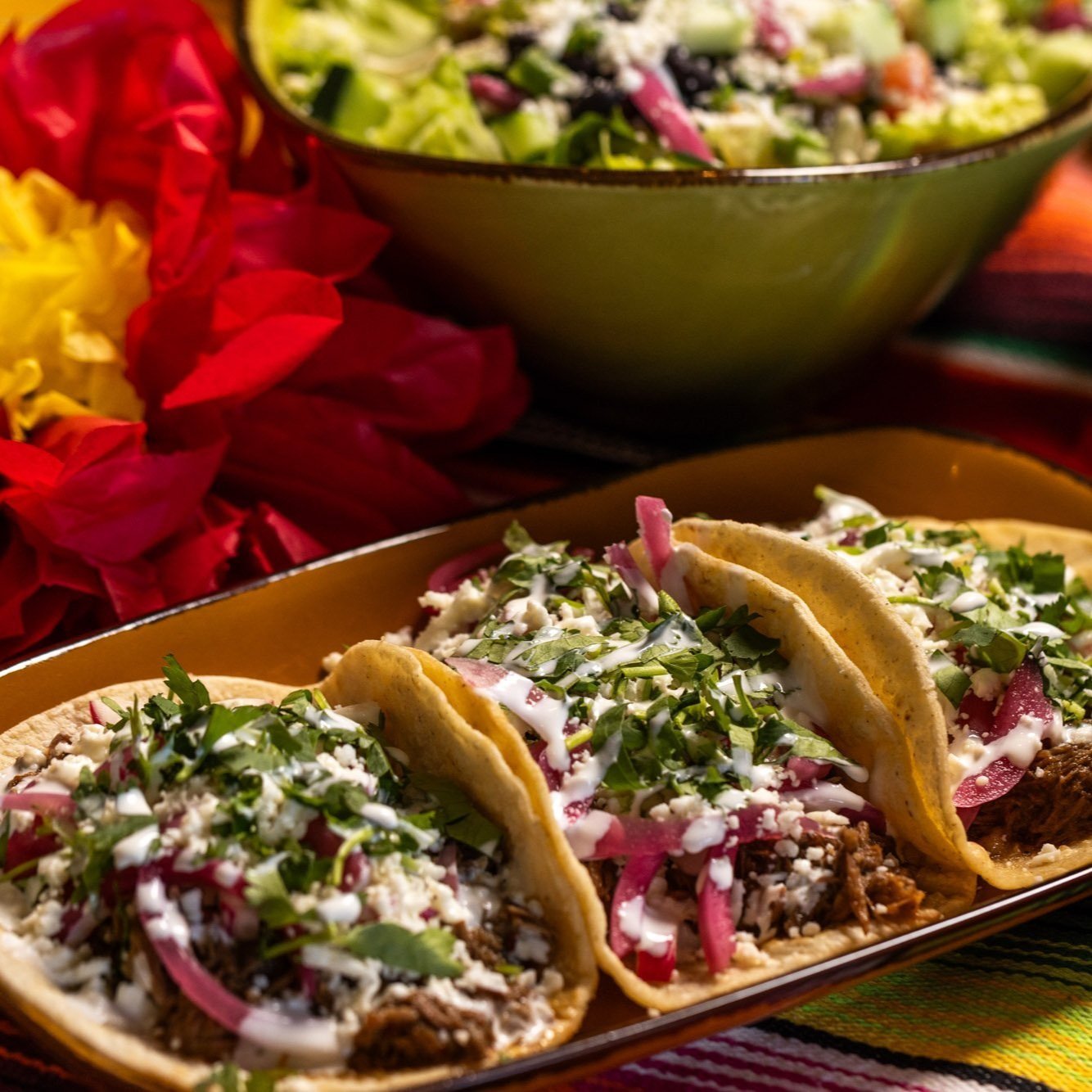 Three+delicious+tacos+served+on+a+festive+table,+representing+the+dishes+on+the+Locals+Tacos+&+Tequila+menu+in+VA.jpeg