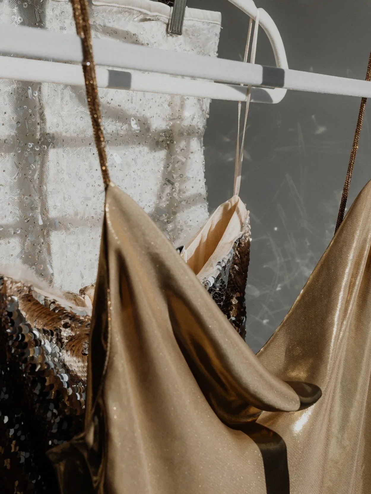 kaboompics_party-essentials-detail-of-glittering-fabrics-for-new-years-eve-silver-sequins-and-gold-satin-33556.webp