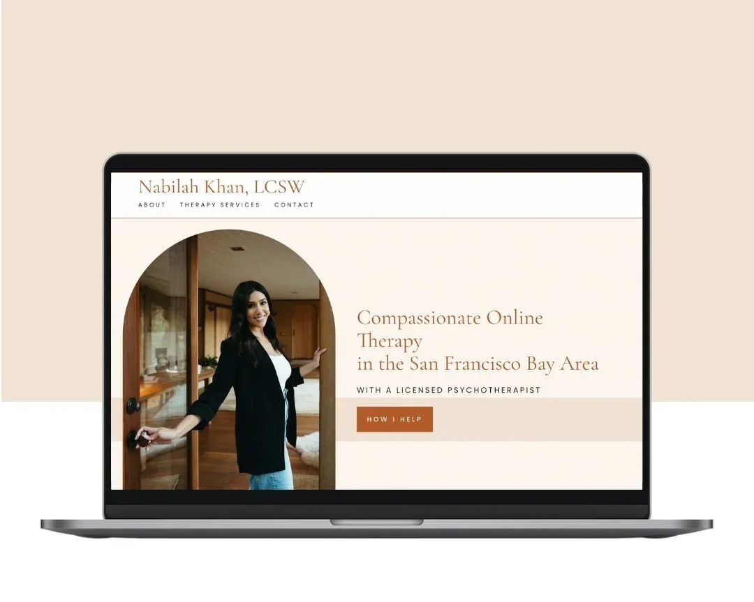 Laptop screen displaying a therapy service website for Nabilah Khan, LCSW, offering online therapy in the San Francisco Bay Area, with a photo of a woman smiling and opening a door.