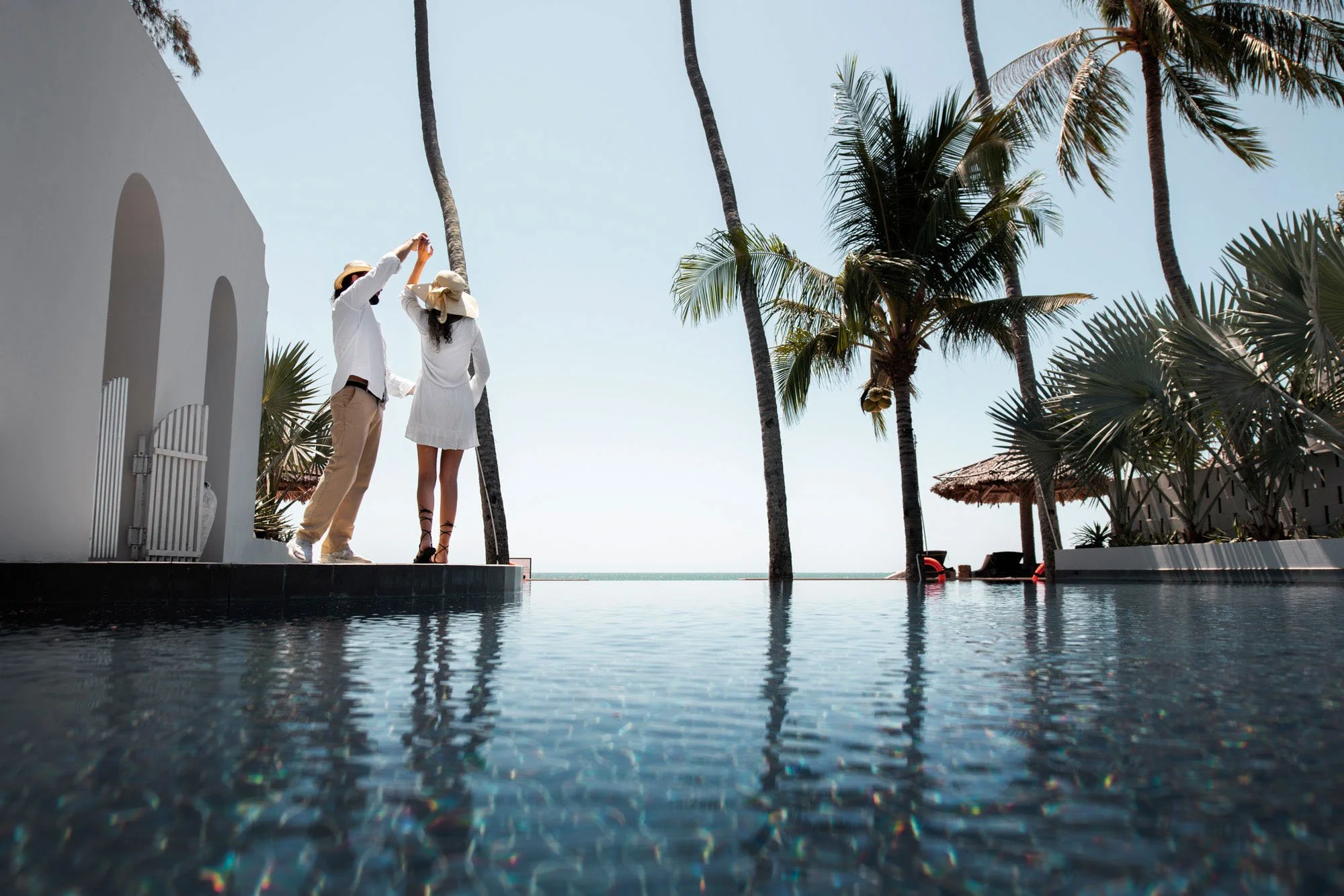 couple-dancing-by-pool-vacation.jpg