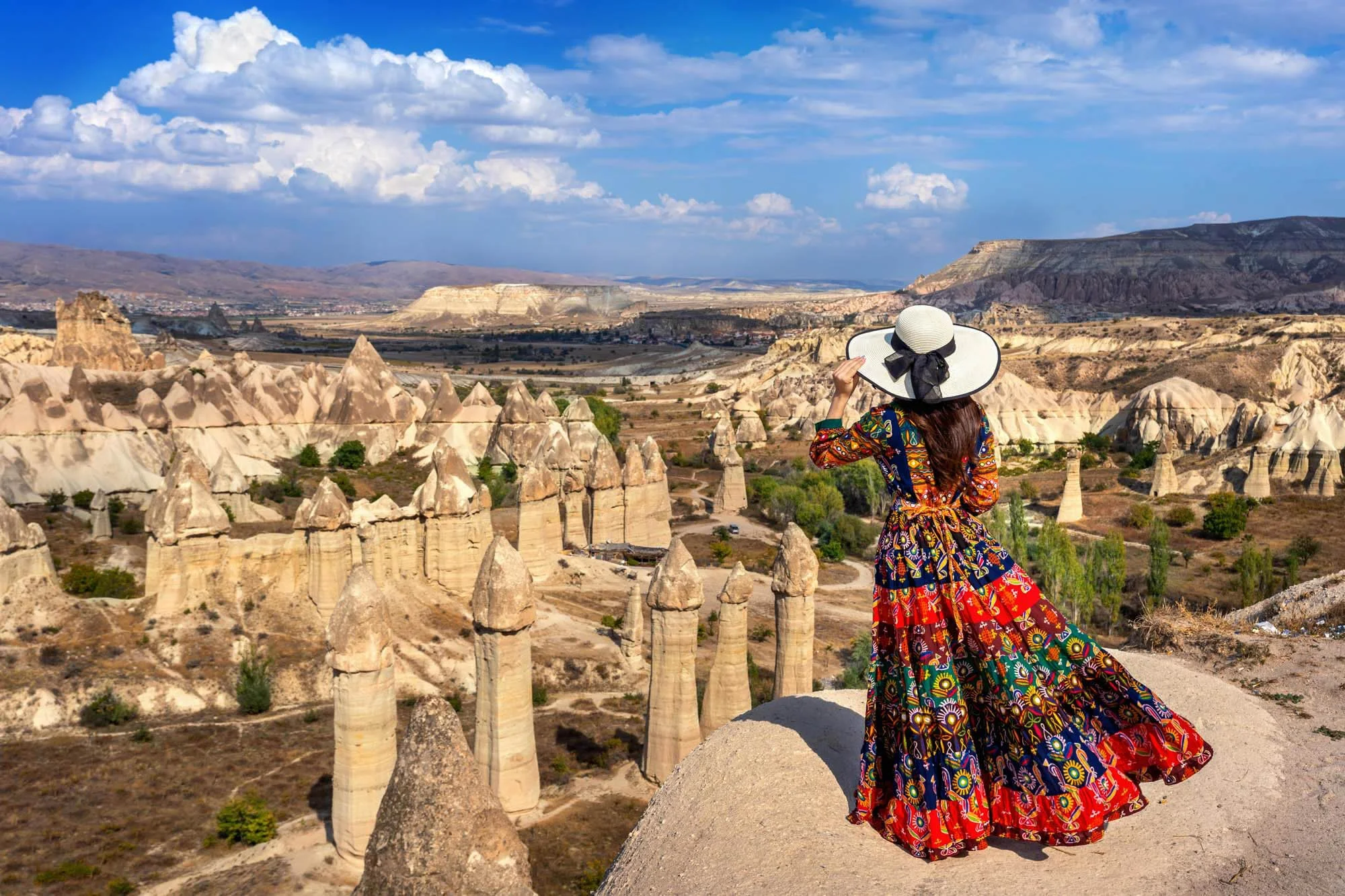 woman-bohemian-dress-standing-love-valley-cappadocia-turkey.jpg