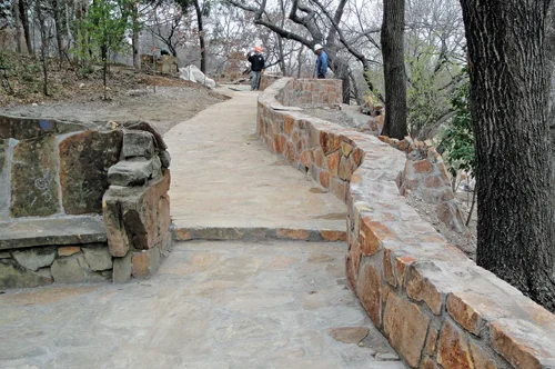 The restored walkways have wonderful views overlooking the adjacent creek and meadow. Landscape improvements will complement this piece of history with the surrounding woodland hillside. Photo Courtesy of Hasen Construction