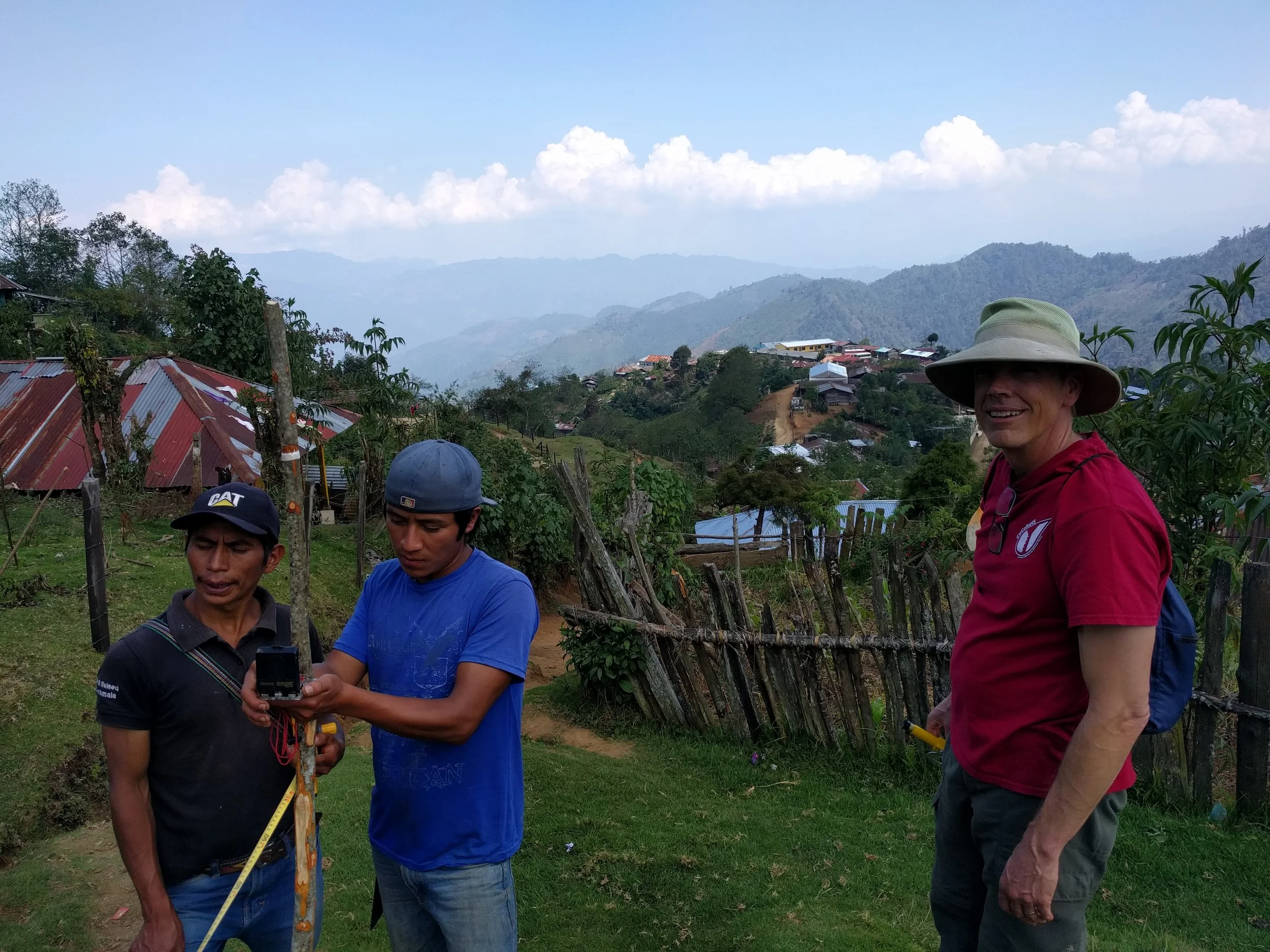 RMP member Jeff Hargis supervising two community member as they helped us survey the distribution lines.