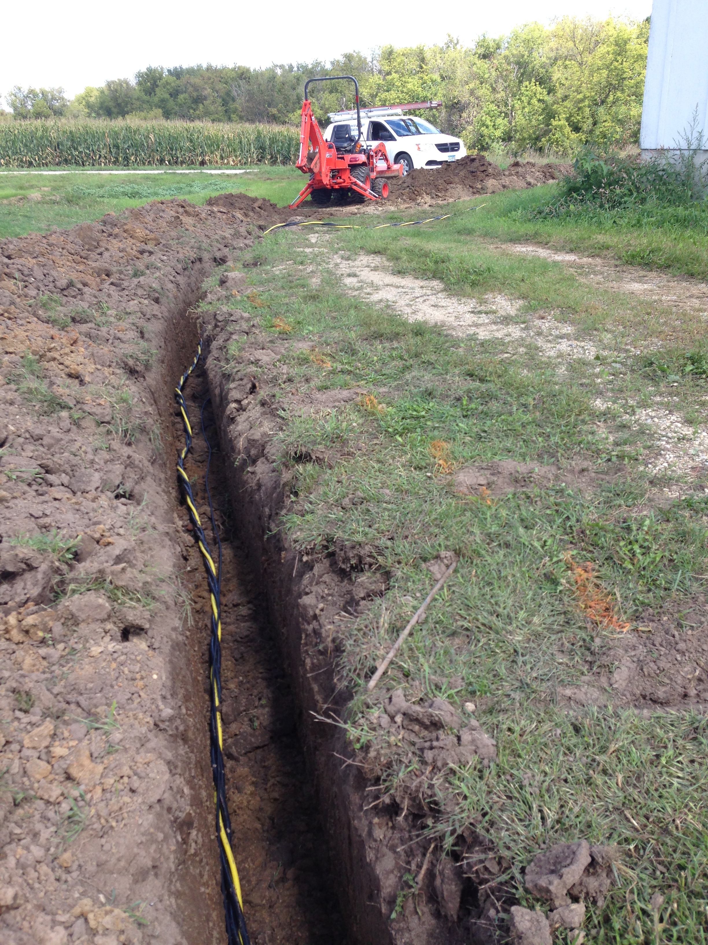 Electric cable laying in a trench.