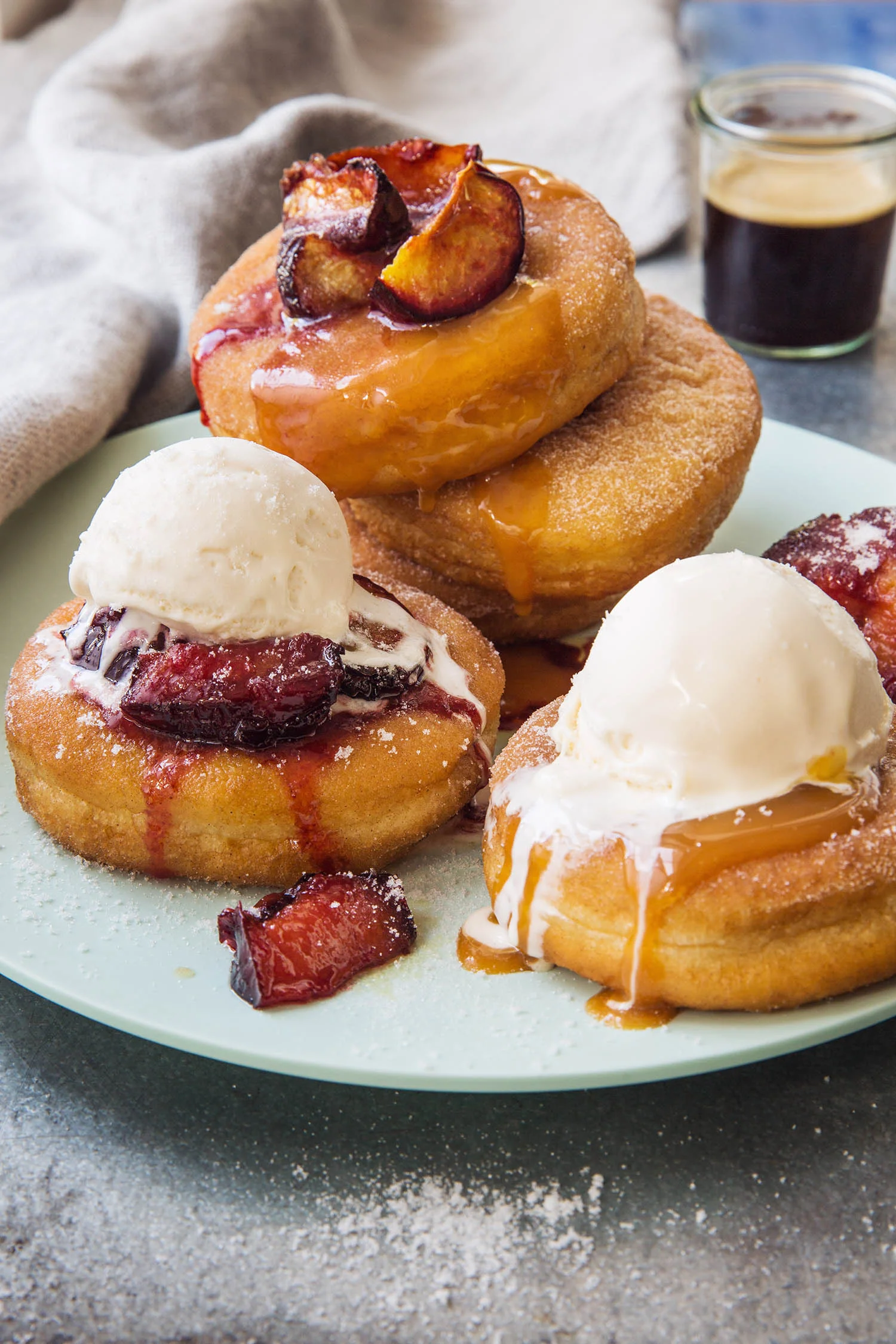 Warm doughnuts with caramel and plum sauce