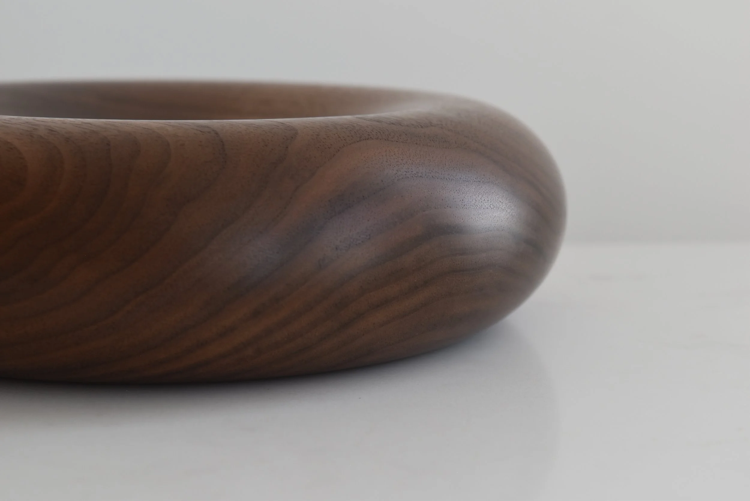 Deep Pillow Plate in American Walnut, close-up of natural wood grain, handmade by Bird and Branch