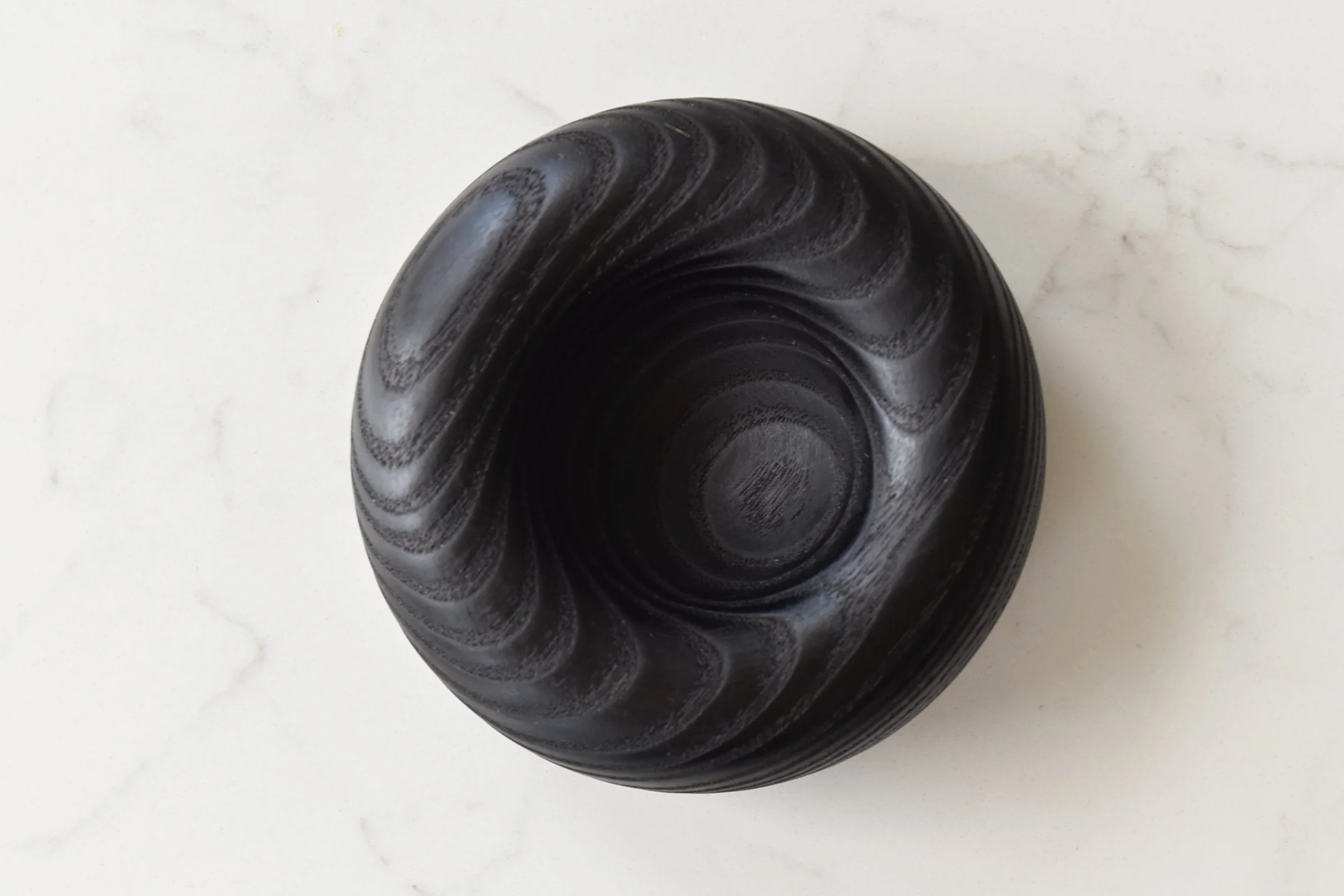 Deep Mini Pillow in Yakisugi, top-down of natural wood grain