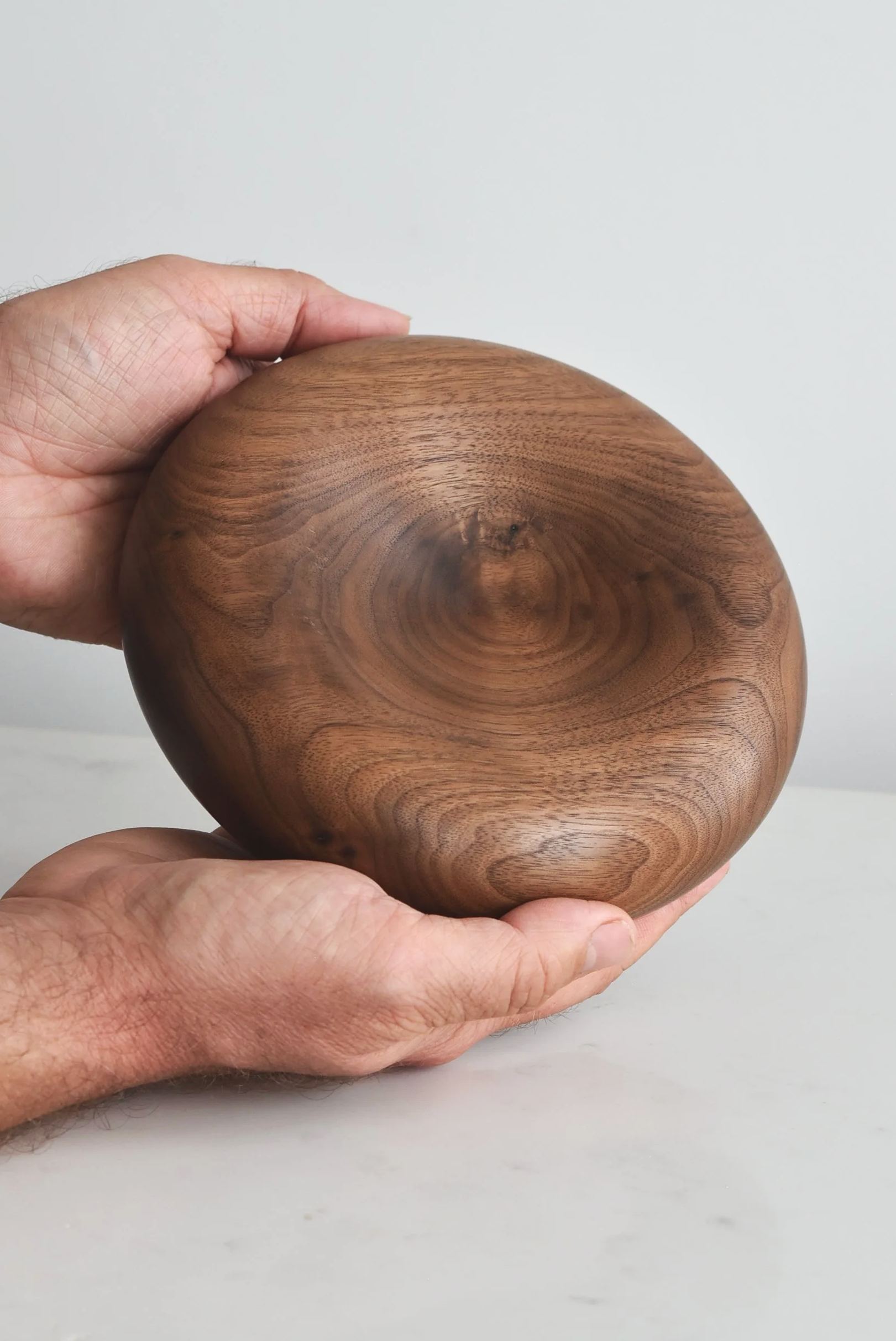 Deep Pillow Plate in American Walnut, additional view product with hands, handmade wooden homeware by Bird & Branch