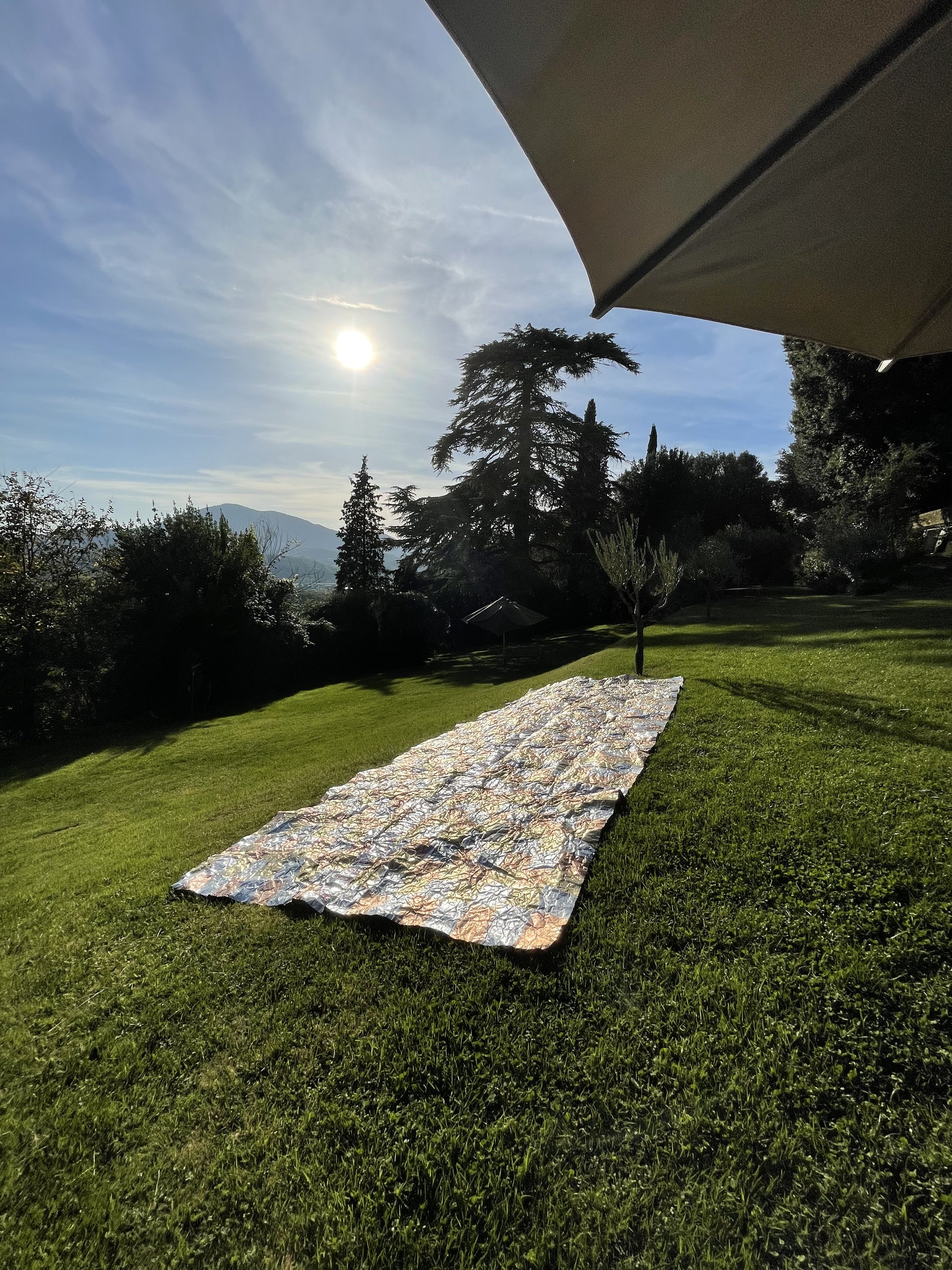   Damaged Emergency Blanket (for the Black Knight satellite having landed in Rome),  2019–2022, installation view, Civitella Ranieri, Umbertide, Italy, composition metal leaf, aluminum leaf, aluminum foil tape on distressed FujiFilm printing plate pa