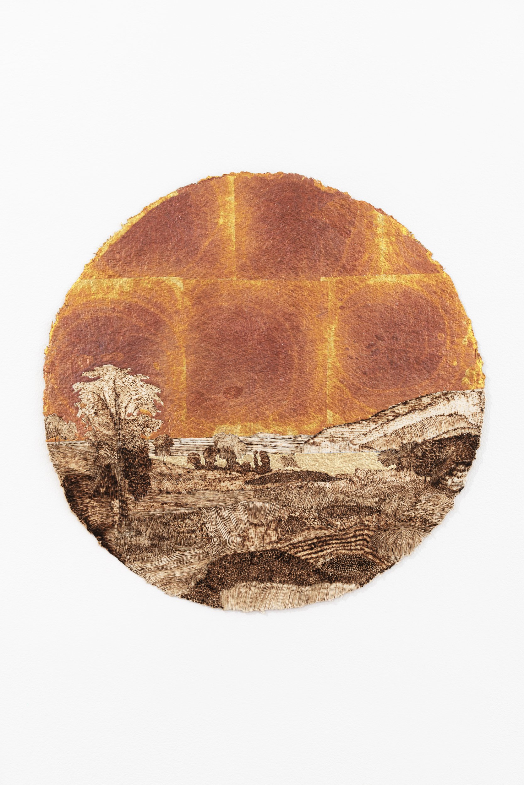   Landscape with Rainbow as the Sun Blasts the Sky (for R.S.D.),  1859/2022, burned handmade paper with blue pencil, variegated metal and composition gold leaf, 16 inches in diameter 