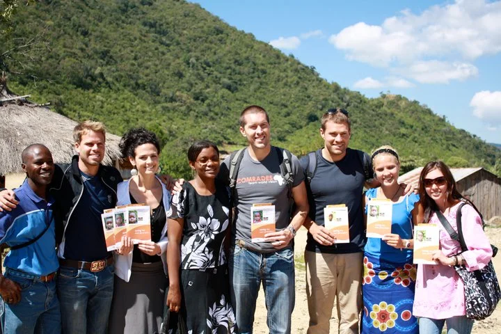 Comrades trip to Kenya all of us with our picture folders.jpg