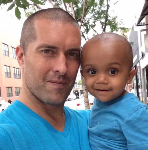 Cruz and his papa in blue.jpg