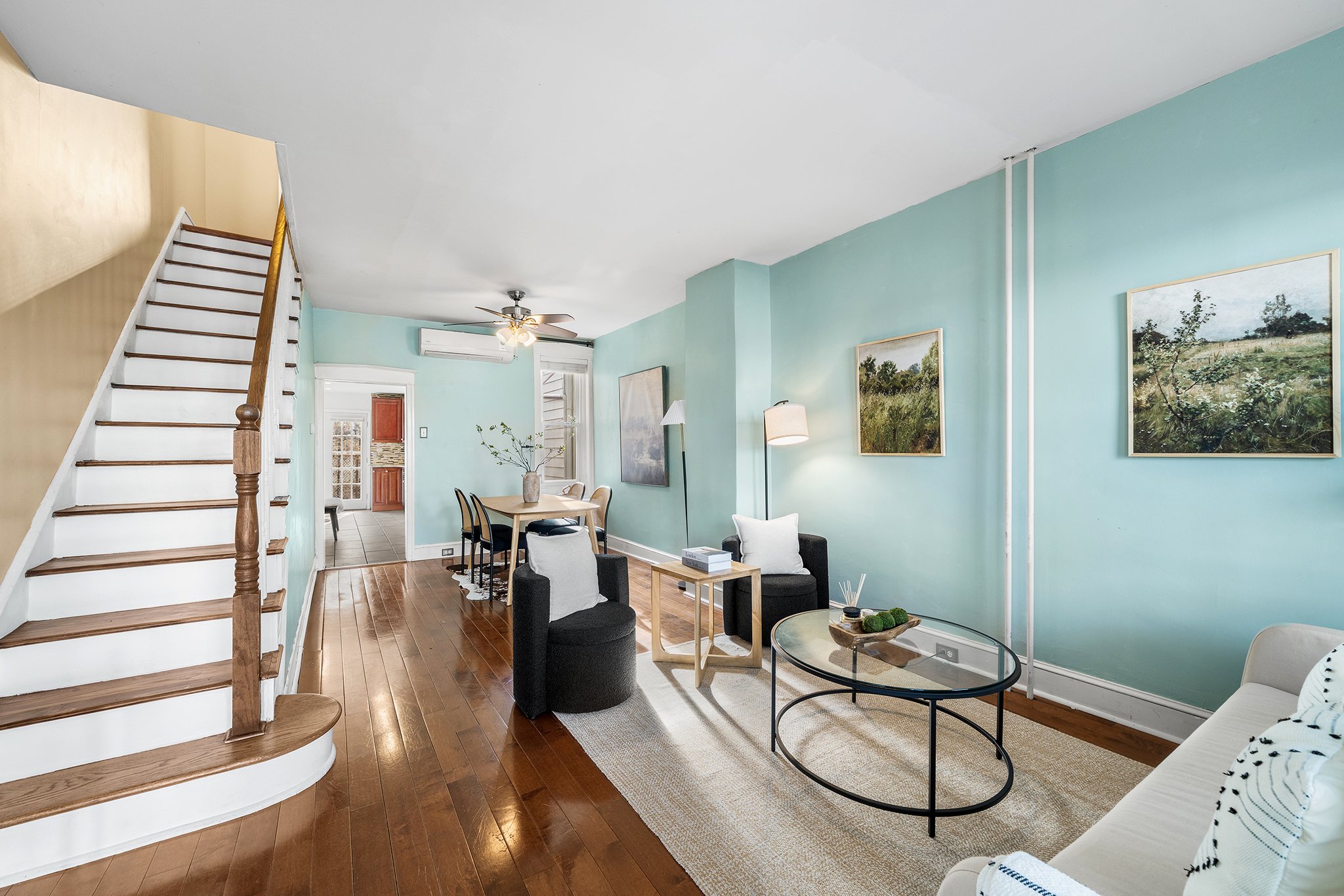 ✨JUST LISTED✨ in Port Richmond! Step on up to the front porch that is waiting for your rockers and morning coffee. Inside you have hardwood floors, tall ceilings and a mini split to keep the floor cool on the first floor. The kitchen has room for you