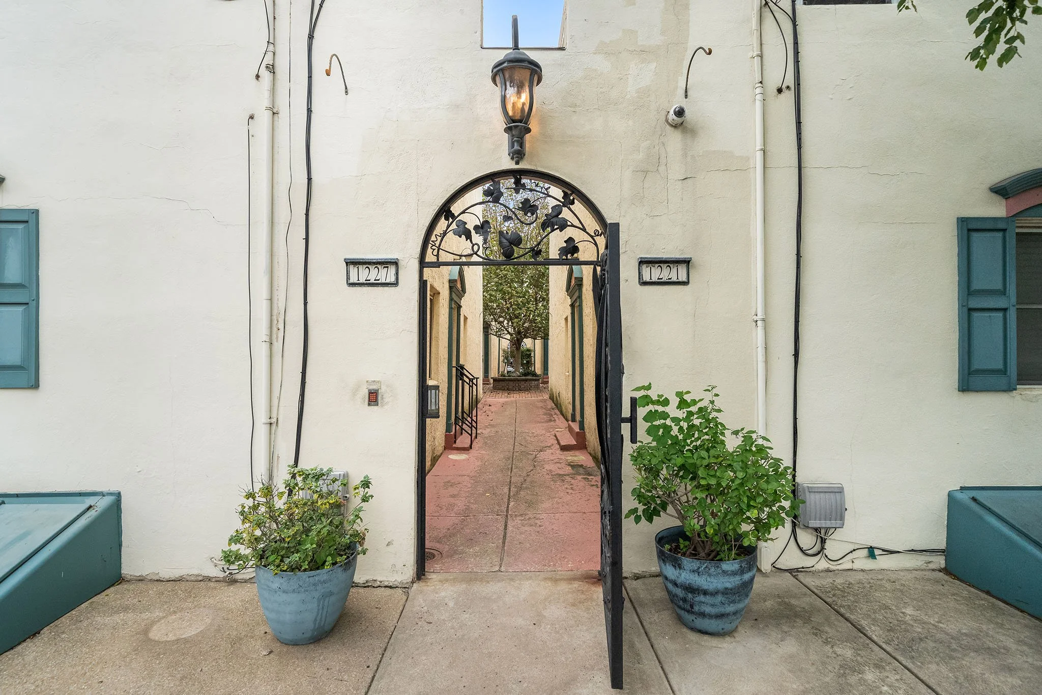 🌙 TWILIGHT OPEN HOUSE!  FRIDAY 1/16🌙 Enter through the wrought iron door, through the magical courtyard tucked in the middle of Fishtown and arrive at your new condo complete with garage parking (again, this is ALL in the middle of Fishtown!). The 