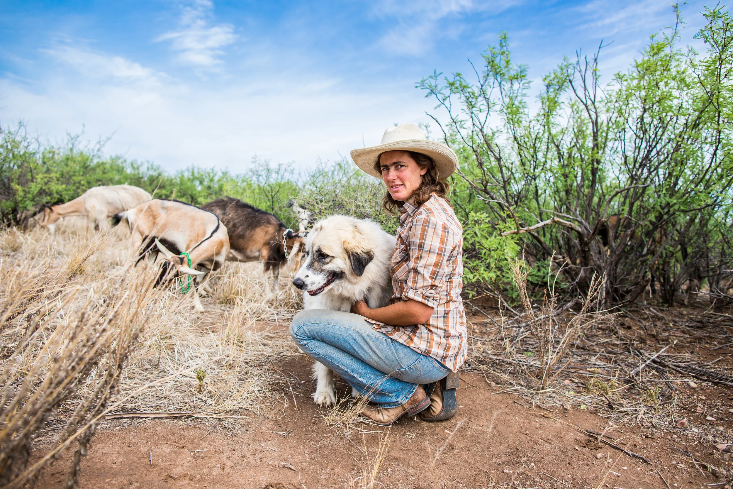 Anastasia with her goats and her guardian dog, Rosie