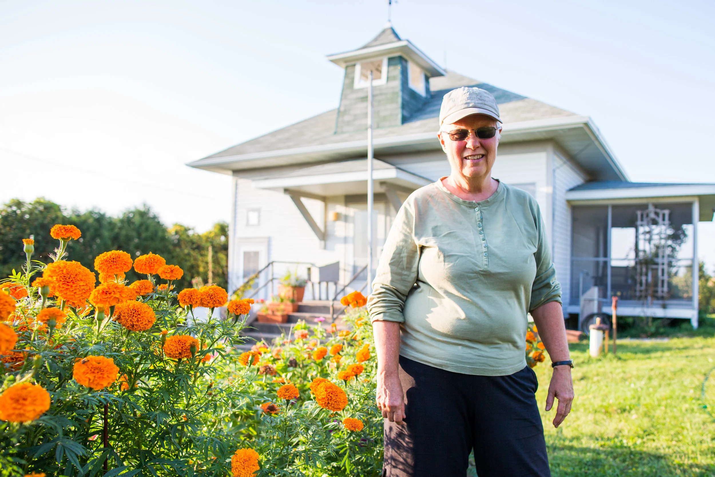 Mary at her Iowa homestead - the home used to serve as the school for local Amish children.