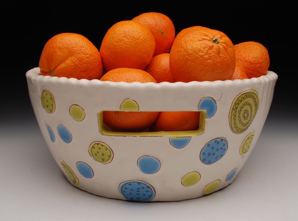 The next body of work featured raised geometric shapes that formed patterns on the surface of the pot.