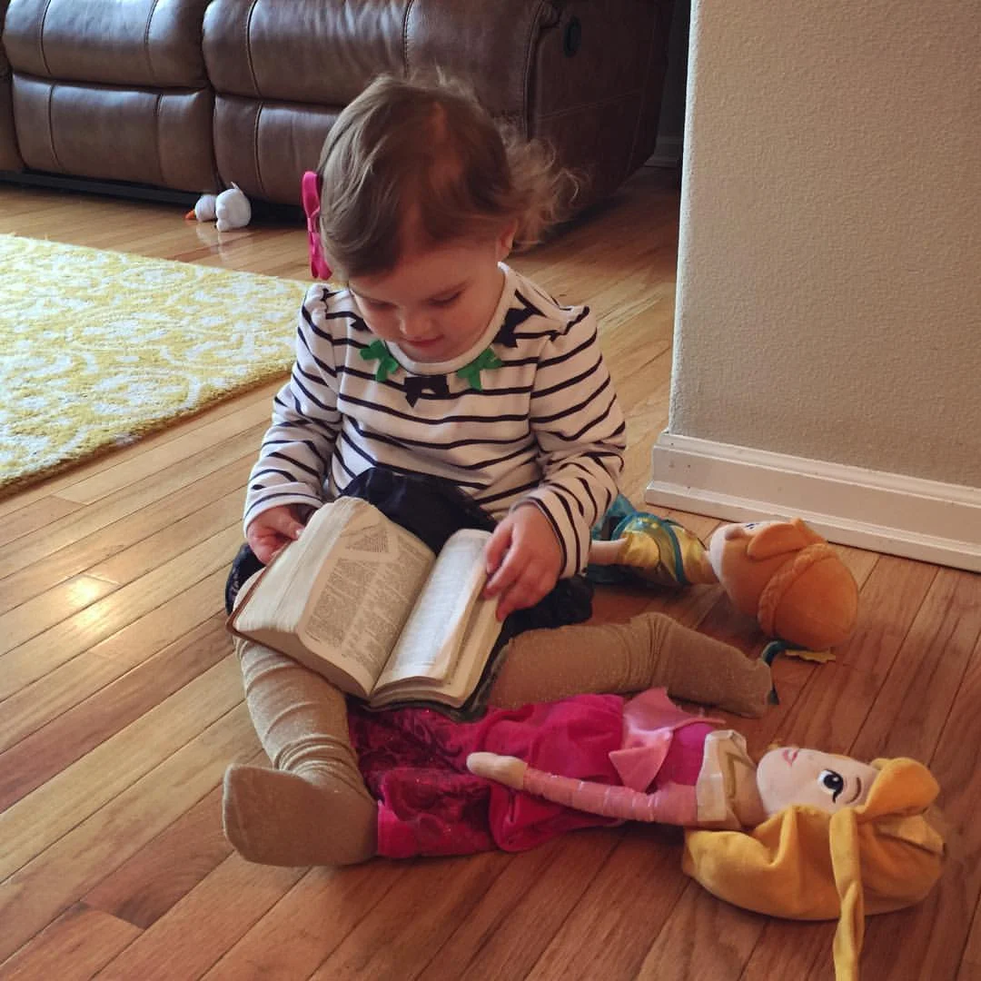 Disney Discipleship.
Valentine was swinging Aurora around the kitchen, and hit her head. She said, “ow.” I told Valentine we could pray that she feels better.
Valentine put Aurora and Anna down, and ran to the side of the couch where Andrea keeps her Bible. She ran over, and started “reading” to her princesses. Might have known that the first bible study she taught would be a Disney one.
šš