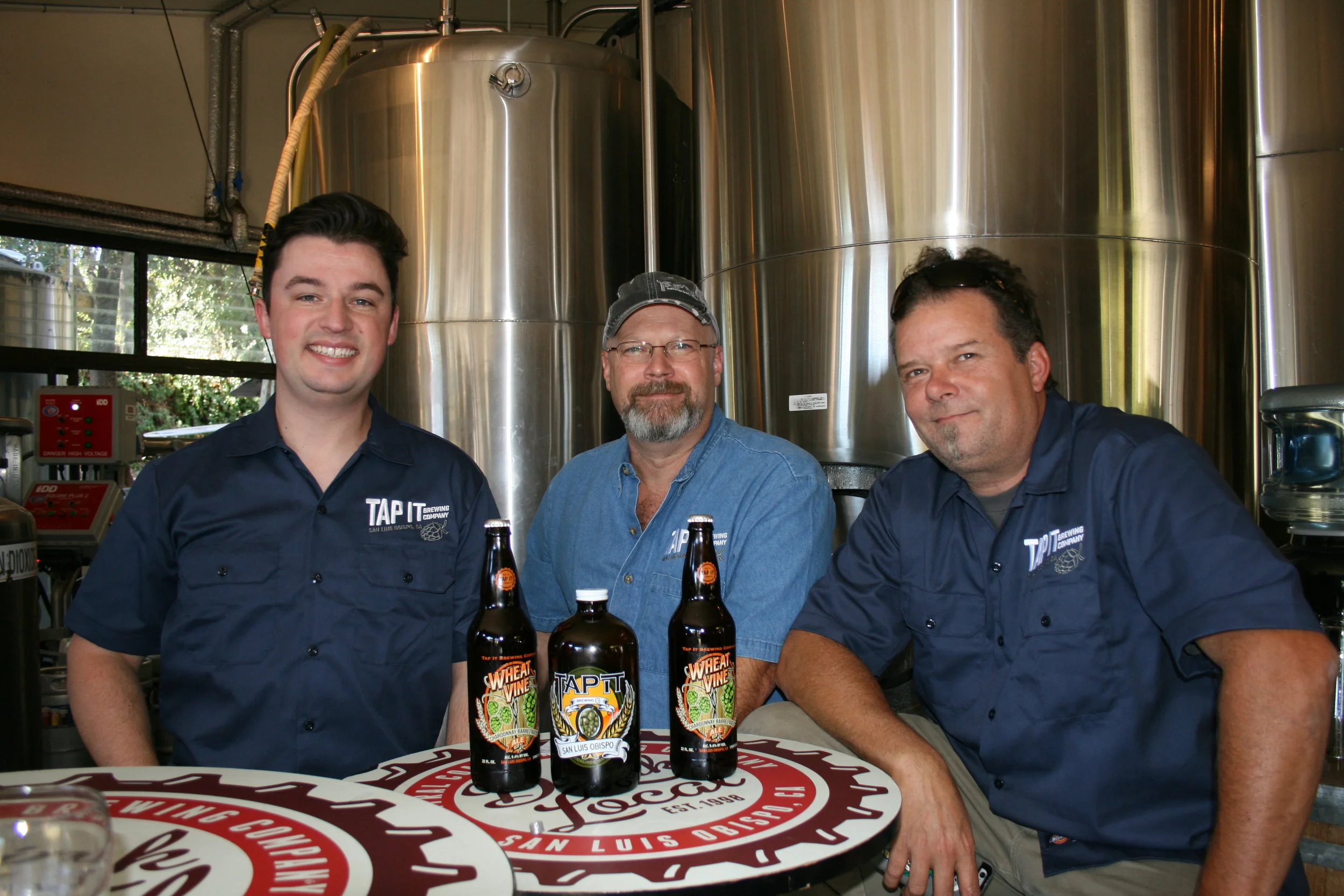 TIME TO TAP IT From left, Tap It Brewing Company Events and Marketing Manager Mike Fogarty, Corporate Controller Matt Dolman, and Head Brewer Ryan Aikens are hosting a SLO Beer Week warm-up event and afterparty this week.